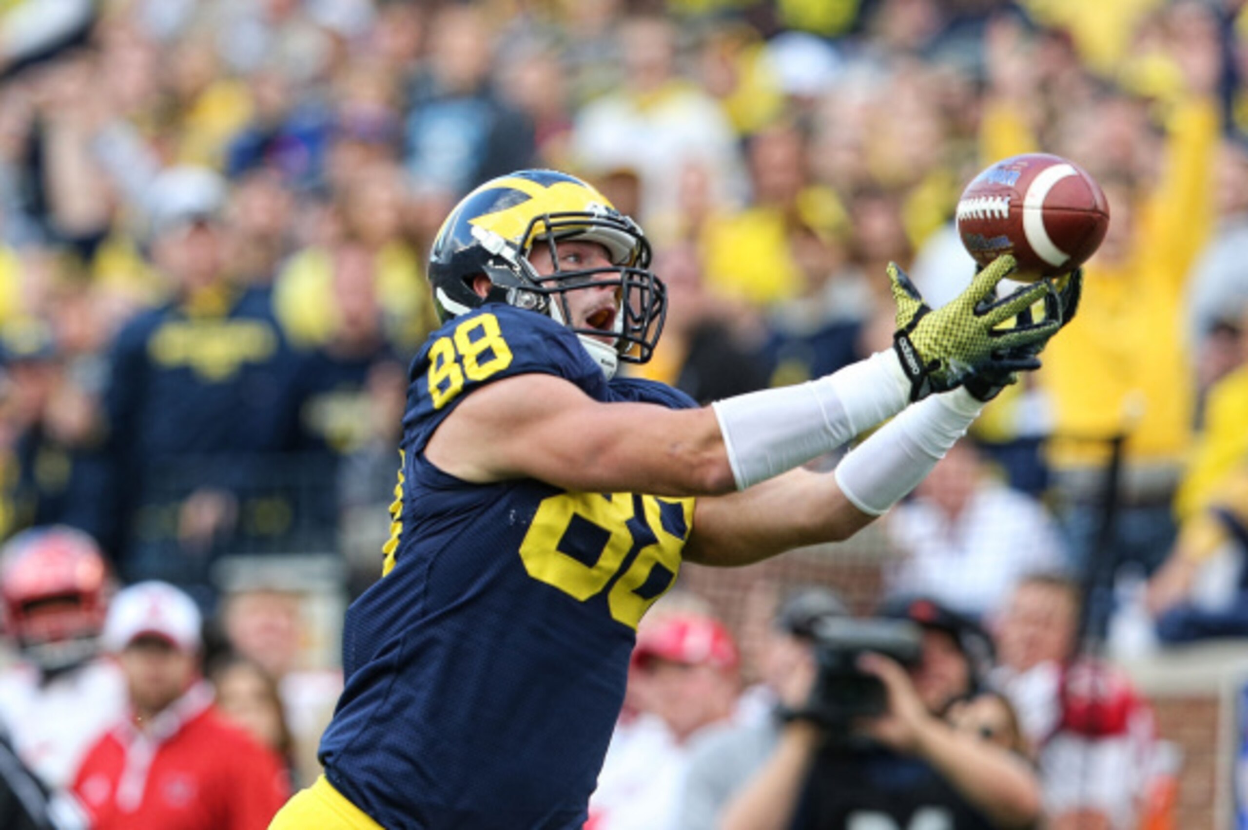 ANN ARBOR, MI - SEPTEMBER 13:  Jake Butt #88 of the Michigan Wolverines catches a 29 yard pass for a third quarter touchdown during the game against the Miami University Redhawks at Michigan Stadium on September 13, 2014 in Ann Arbor, Michigan. the Wolver