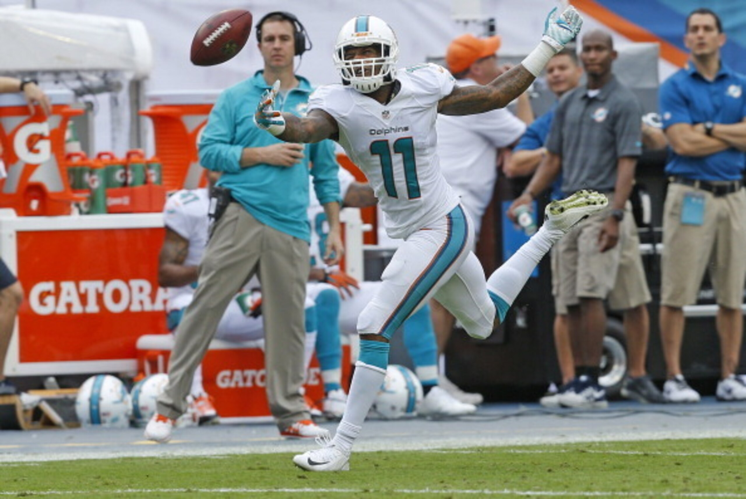 MIAMI GARDENS, FL - DECEMBER 29: Mike Wallace #11 is unable to catch the ball thrown by Ryan Tannehill #17 (not pictured) of the Miami Dolphins during second quarter action against the New York Jets on December 29, 2013 at Sun Life Stadium in Miami Garden