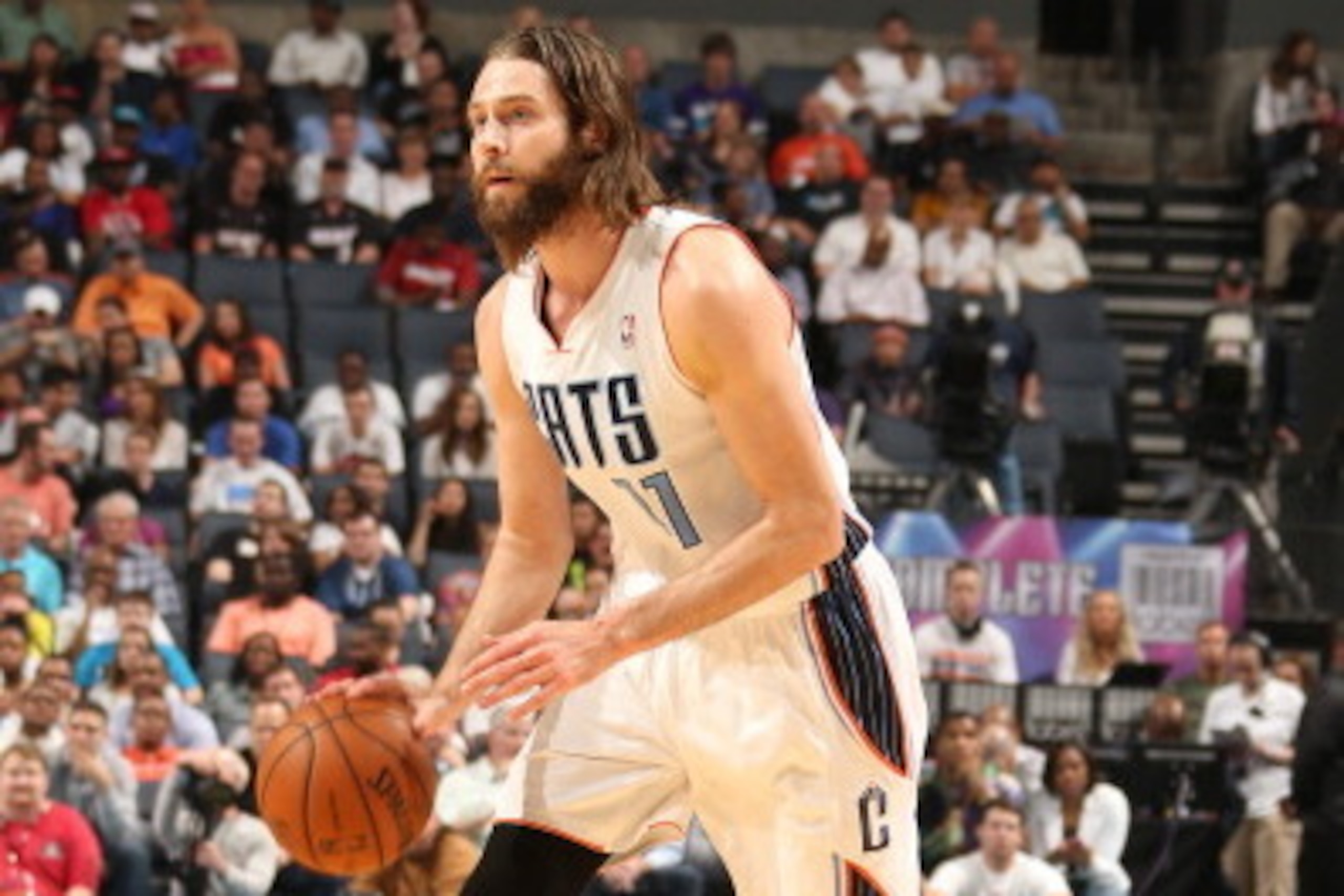 CHARLOTTE, NC - APRIL 28: Josh McRoberts #11 of the Charlotte Bobcats handles the ball against the Miami Heat in Game Four of the Eastern Conference Quarterfinals in the 2014 NBA Playoffs at the Time Warner Cable Arena on April 28, 2014 in Charlotte, Nort