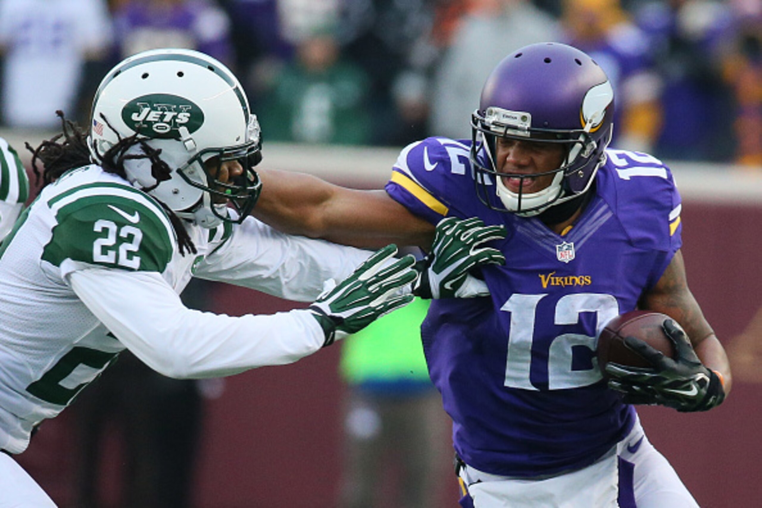 MINNEAPOLIS, MN - DECEMBER 7: Charles Johnson #12 of the Minnesota Vikings stiff arms Marcus Williams #22 of the New York Jets in the fourth quarter on December 7, 2014 at TCF Bank Stadium in Minneapolis, Minnesota. (Photo by Adam Bettcher/Getty Images)