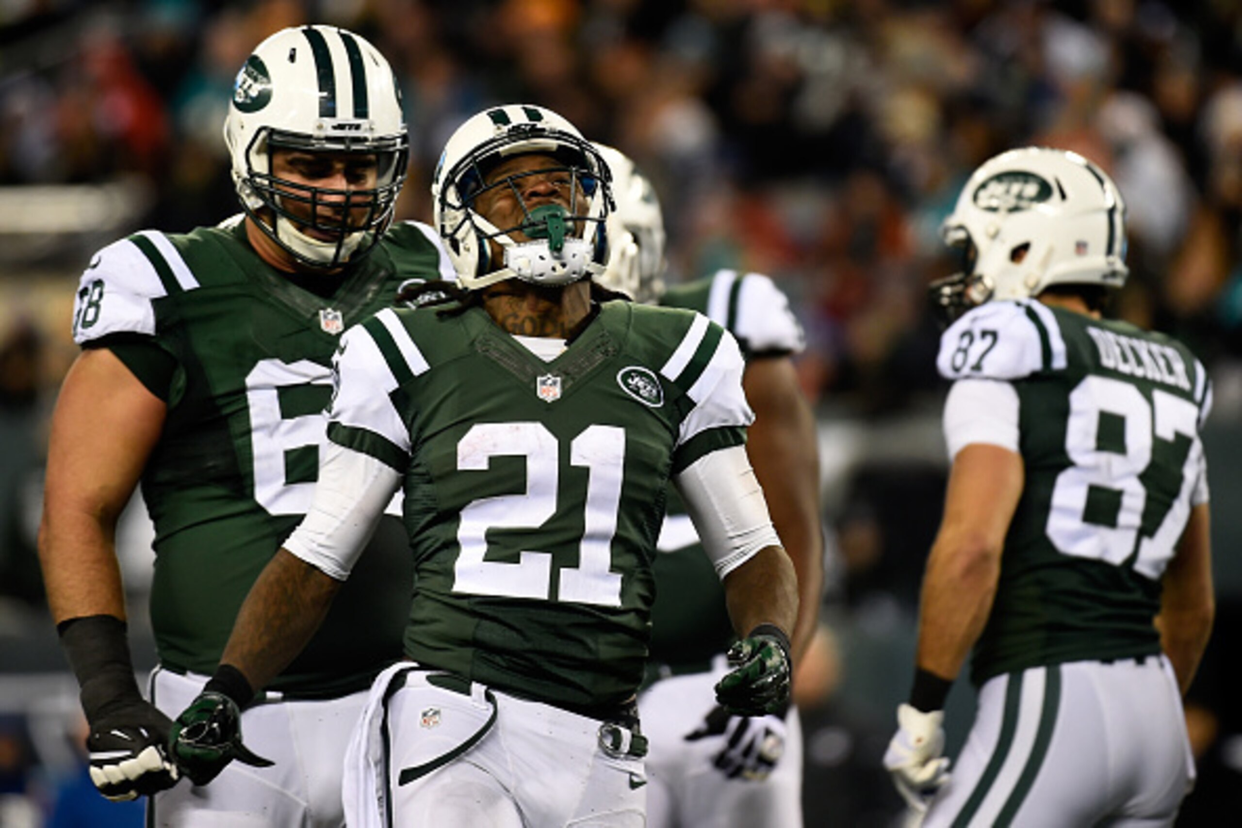 EAST RUTHERFORD, NJ - DECEMBER 01:  Chris Johnson #21 of the New York Jets reacts to a run against the Miami Dolphins during their game at MetLife Stadium on December 1, 2014 in East Rutherford, New Jersey.  (Photo by Alex Goodlett/Getty Images)