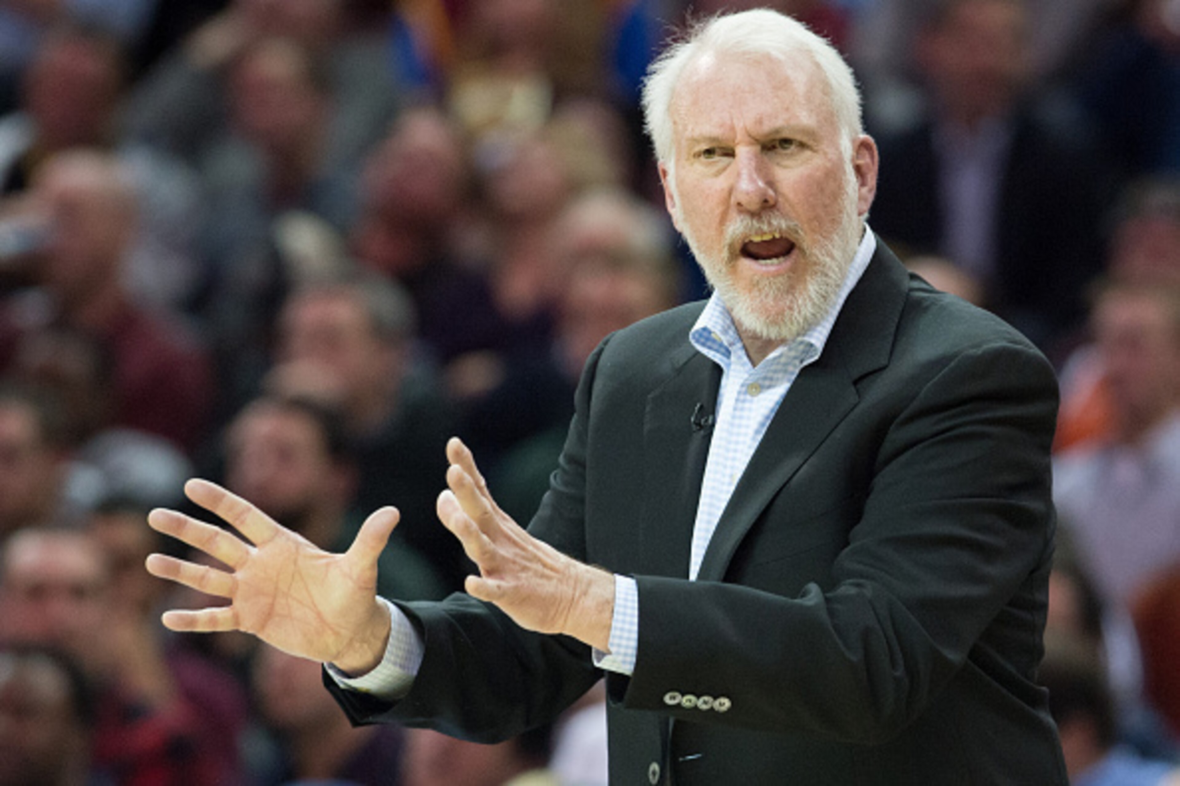 CLEVELAND, OH - NOVEMBER 19:  Head coach Gregg Popovich of the San Antonio Spurs yells to his players during the second half against the Cleveland Cavaliers at Quicken Loans Arena on November 19, 2014 in Cleveland, Ohio. The Spurs defeated the Cavs 92-90.