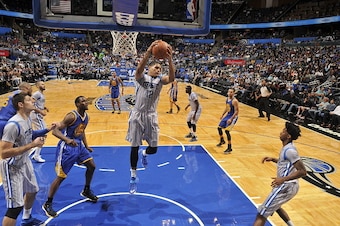 ORLANDO, FL - NOVEMBER 26:  Tobias Harris #12 of the Orlando Magic grabs the rebound against the Golden State Warriors during the game on November 26, 2014 at Amway Center in Orlando, Florida. NOTE TO USER: User expressly acknowledges and agrees that, by 