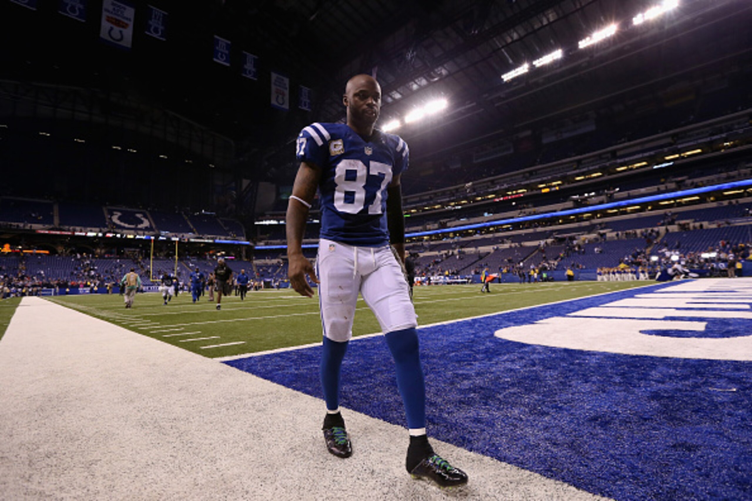 INDIANAPOLIS, IN - NOVEMBER 16:  Reggie Wayne #87 of the Indianapolis Colts walks off the field after their 42-20 loss to the New England Patriots at Lucas Oil Stadium on November 16, 2014 in Indianapolis, Indiana.  (Photo by Andy Lyons/Getty Images)