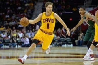 Oct 14, 2014; Cleveland, OH, USA; Cleveland Cavaliers guard Matthew Dellavedova (8) dribbles against the Milwaukee Bucks at Quicken Loans Arena. Cleveland won 106-100. Mandatory Credit: David Richard-USA TODAY Sports