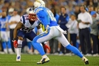 Dec 7, 2014; San Diego, CA, USA; New England Patriots cornerback Darrelle Revis (24) defends San Diego Chargers wide receiver Keenan Allen (13) during the fourth quarter at Qualcomm Stadium. Mandatory Credit: Jake Roth-USA TODAY Sports