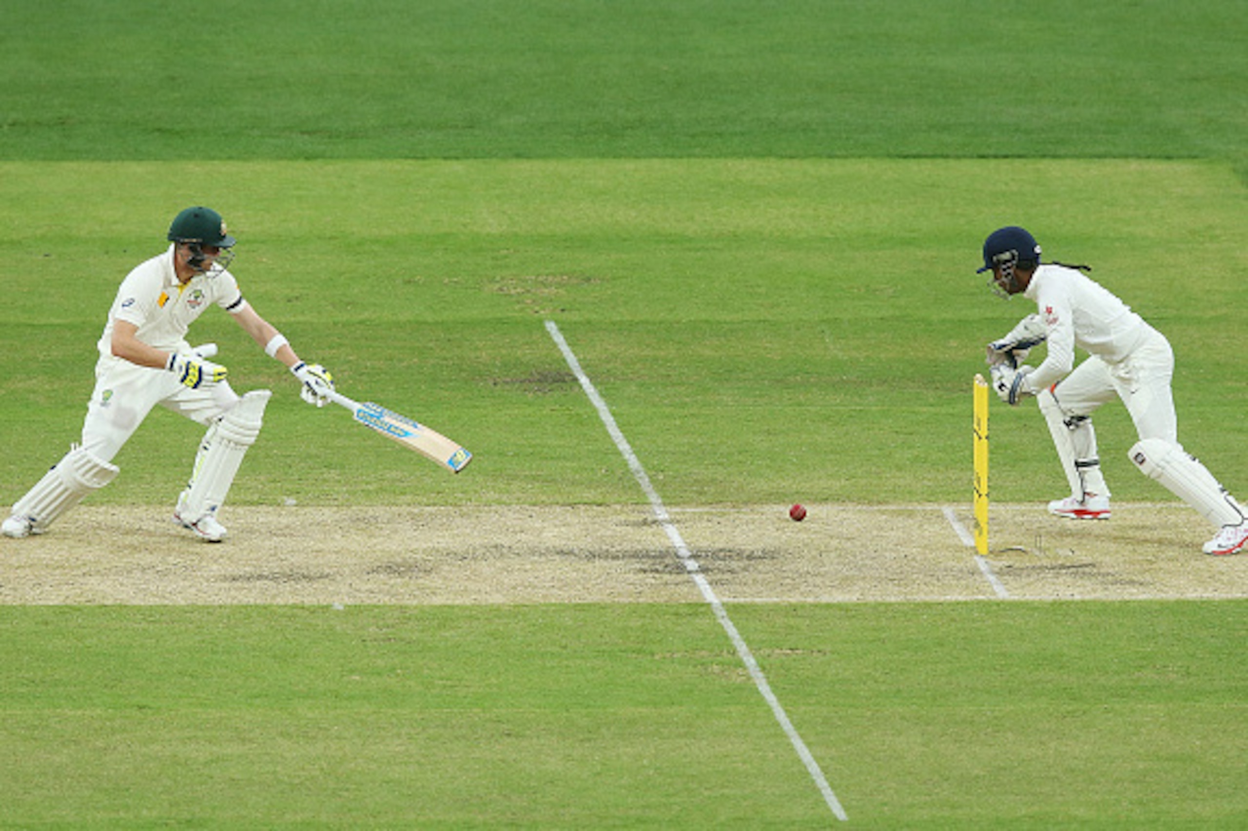 ADELAIDE, AUSTRALIA - DECEMBER 10:  Wriddhiman Saha of India misses a chance to stump Steve Smith of Australia during day two of the First Test match between Australia and India at Adelaide Oval on December 10, 2014 in Adelaide, Australia.  (Photo by Mich