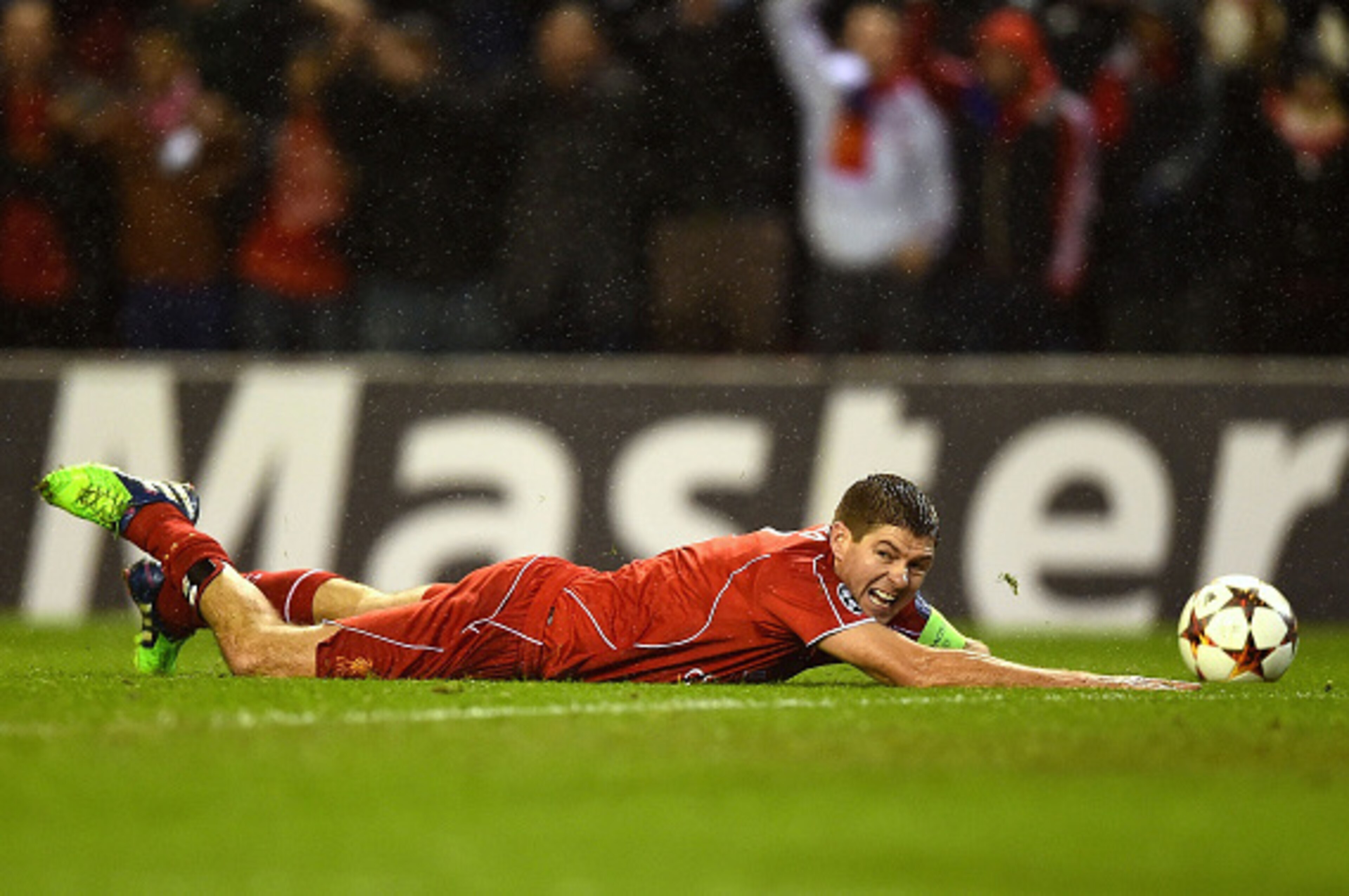 LIVERPOOL, ENGLAND - DECEMBER 09:  Steven Gerrard of Liverpool goes down in the down in the area during the UEFA Champions League group B match between Liverpool and FC Basel 1893 at Anfield on December 9, 2014 in Liverpool, United Kingdom.  (Photo by Lau