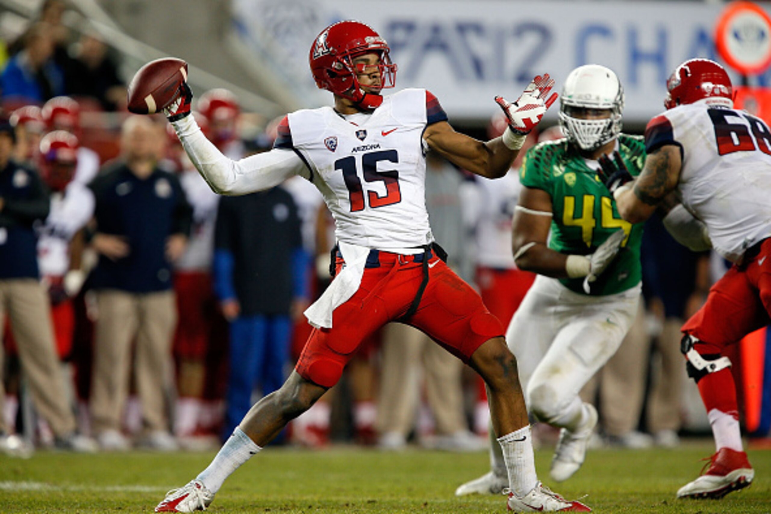 SANTA CLARA, CA - DECEMBER 05: Anu Solomon #12 of the Arizona Wildcats looks downfield against the Oregon Ducks during the PAC-12 Championships at Levi's Stadium on December 5, 2014 in Santa Clara, California. (Photo by Brian Bahr/Getty Images)