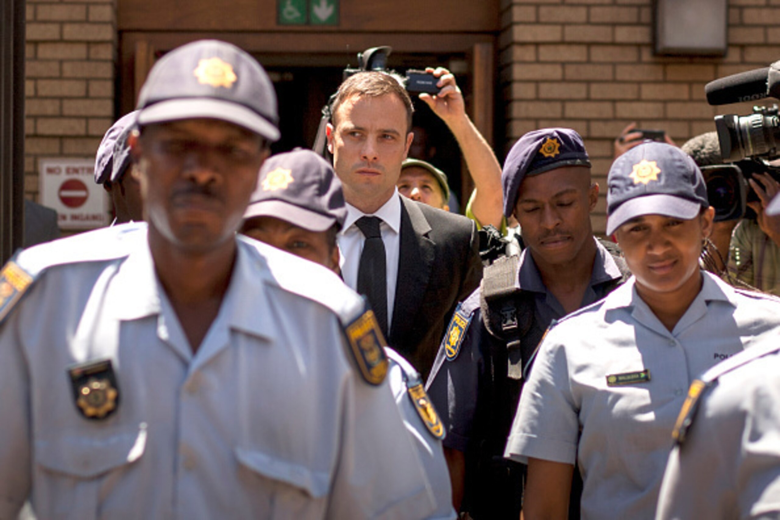 PRETORIA, SOUTH AFRICA - OCTOBER 17: Oscar Pistorius leaves the North Gauteng High Court after the fifth day of sentencing on October 17, 2014 in Pretoria, South Africa. The defence and the state have now concluded their arguments and the judge will now d
