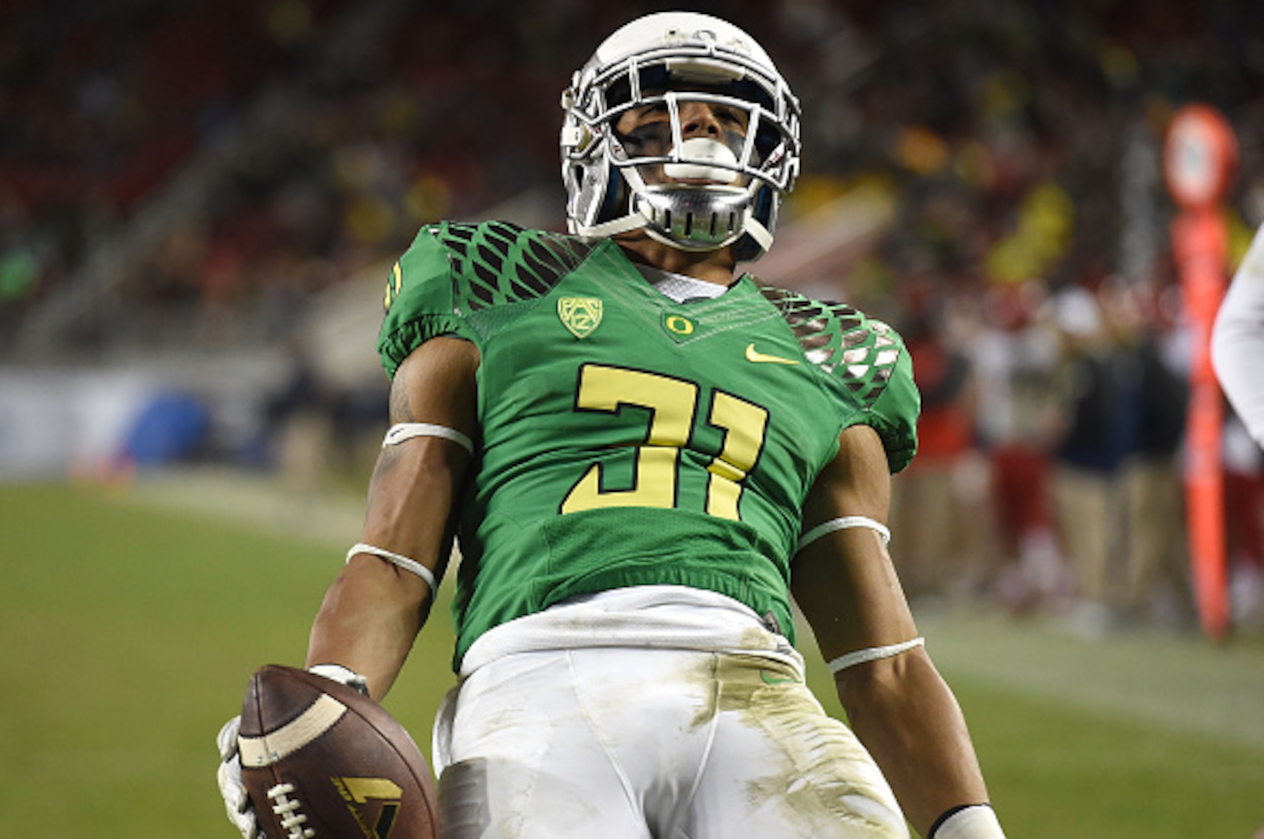 SANTA CLARA, CA - DECEMBER 05:  Kenny Bassett #31 of the Oregon Ducks celebrates a late game touchdown with  during the PAC-12 Championships against the Arizona Wildcatsat Levi's Stadium on December 5, 2014 in Santa Clara, California.  (Photo by Thearon W