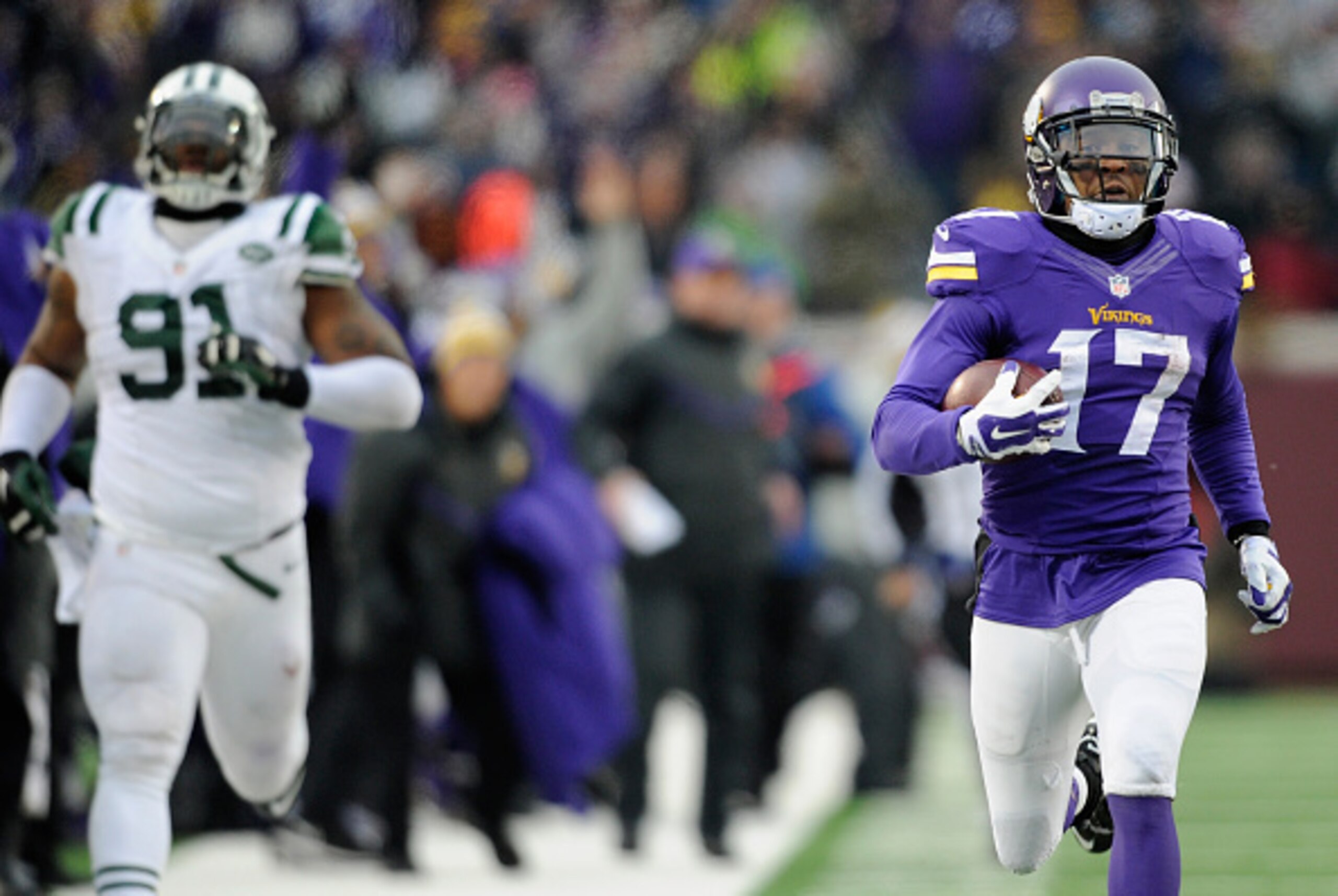 MINNEAPOLIS, MN - DECEMBER 7: Jarius Wright #17 of the Minnesota Vikings carries the ball for a touchdown as Sheldon Richardson #91 gives chase during overtime of the New York Jets  of the game on December 7, 2014 at TCF Bank Stadium in Minneapolis, Minne