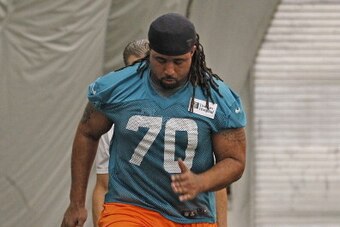 DAVIE, FL - MAY 3:  Dallas Thomas #70 of the Miami Dolphins runs through drills during the rookie camp on May 3, 2013 at the Miami Dolphins training facility in Davie, Florida.  (Photo by Joel Auerbach/Getty Images)
