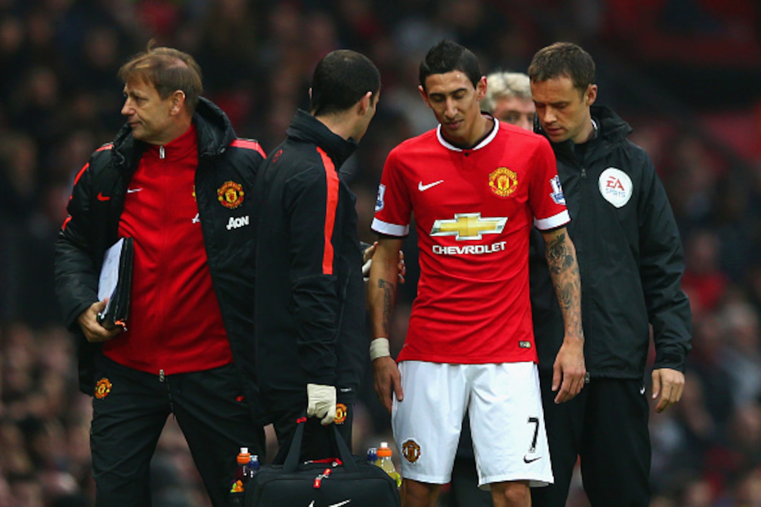 MANCHESTER, ENGLAND - NOVEMBER 29:  Injured Angel di Maria of Manchester United receives treatment during the Barclays Premier League match between Manchester United and Hull City at Old Trafford on November 29, 2014 in Manchester, England.  (Photo by Mat