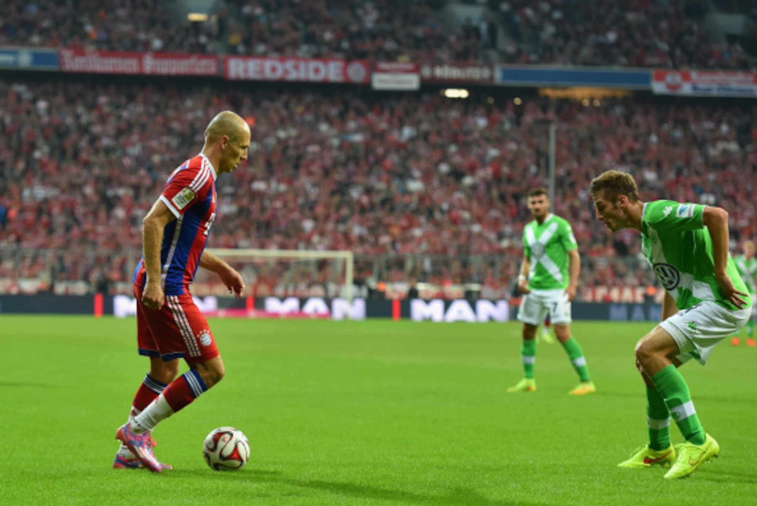 MUNICH, GERMANY - AUGUST 22: Arjen Robben of Muenchen controls the ball during the Bundesliga match between FC Bayern Muenchen and VfL Wolfsburg at Allianz Arena on August 22, 2014 in Munich, Germany. (Photo by Stuart Franklin/Getty Images For MAN) MUNICH, GERMANY - AUGUST 22: Arjen Robben of Muenchen controls the ball during the Bundesliga match between FC Bayern Muenchen and VfL Wolfsburg at Allianz Arena on August 22, 2014 in Munich, Germany. (Photo by Stuart Franklin/Getty Images For MAN)