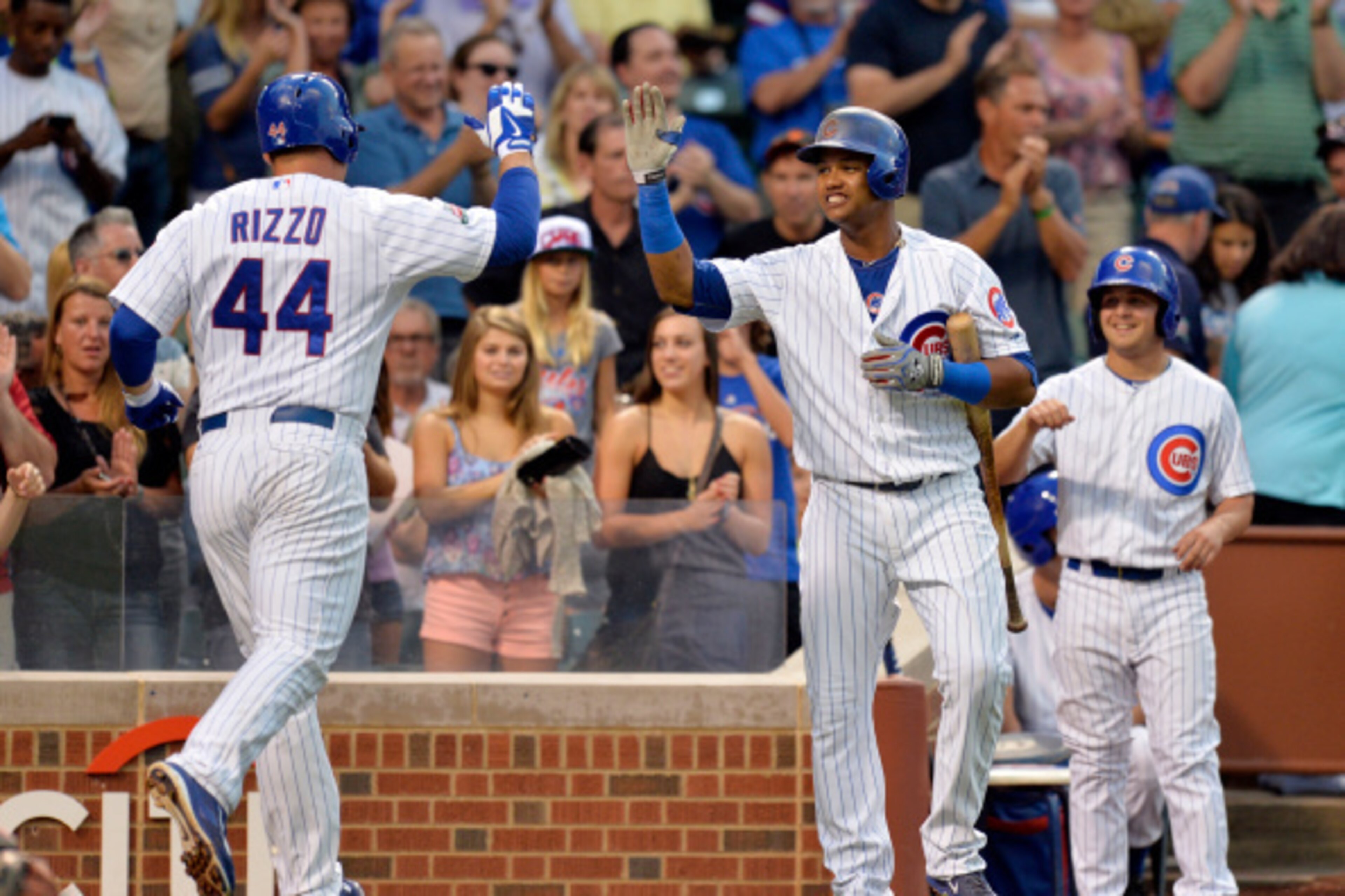 CHICAGO, IL - AUGUST 19: Starlin Castro #13 of the Chicago Cubs high-fives teammate Anthony Rizzo #44 after Rizzo hit a two-run home run scoring Javier Baez during the first inning against the San Francisco Giants at Wrigley Field on August 19, 2014 in C CHICAGO, IL - AUGUST 19: Starlin Castro #13 of the Chicago Cubs high-fives teammate Anthony Rizzo #44 after Rizzo hit a two-run home run scoring Javier Baez during the first inning against the San Francisco Giants at Wrigley Field on August 19, 2014 in C