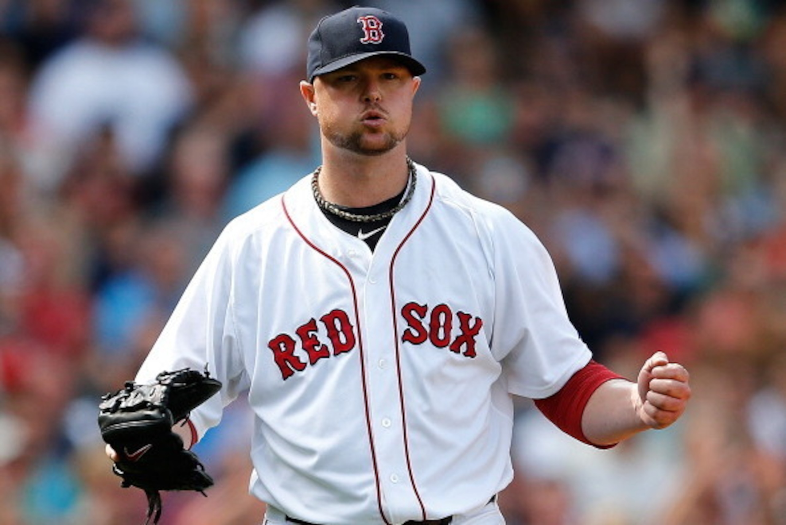 BOSTON, MA - JULY 20: Jon Lester #31 of the Boston Red Sox reacts after getting out of trouble in the sixth inning against the Kansas City Royals at Fenway Park on July 20, 2014 in Boston, Massachusetts.  (Photo by Jim Rogash/Getty Images)