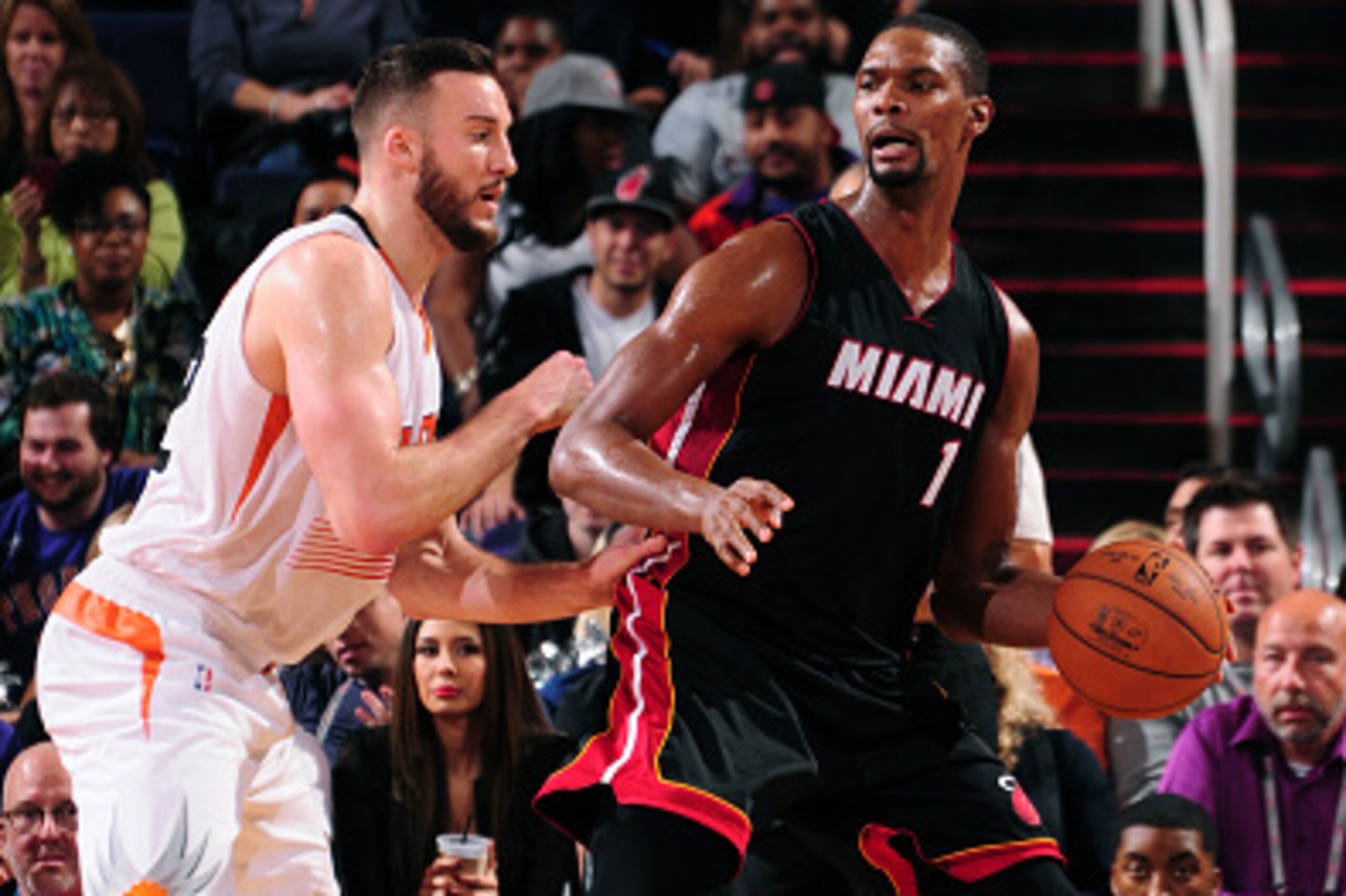 PHOENIX, AZ - DECEMBER 9:  Chris Bosh #1 of the Miami Heat handles the ball against the Phoenix Suns during the game on December 9, 2014 at U.S. Airways Center in Phoenix, Arizona. NOTE TO USER: User expressly acknowledges and agrees that, by downloading 