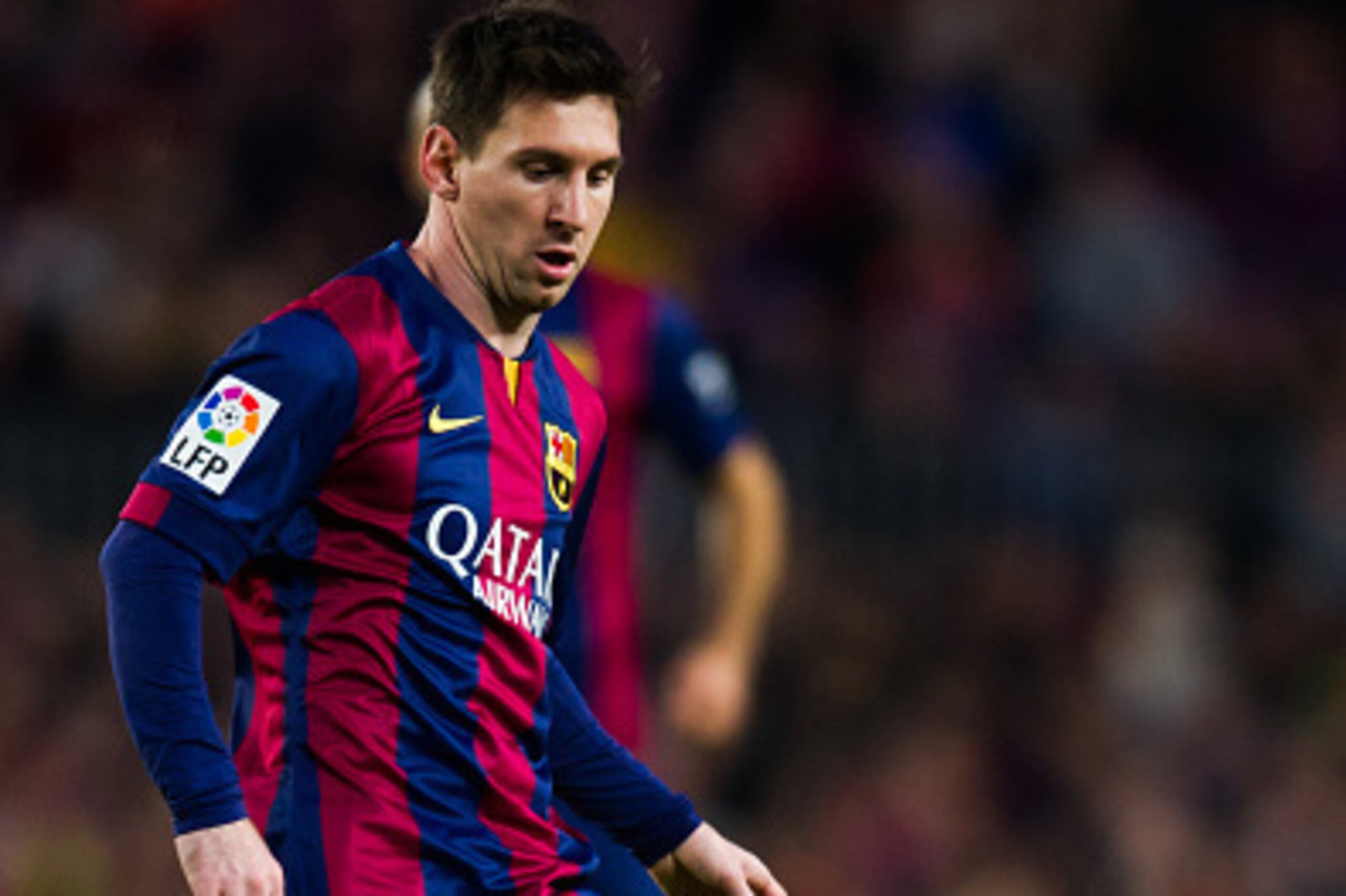 BARCELONA, SPAIN - DECEMBER 07: Lionel Messi of FC Barcelona plays the ball during the La Liga match between FC Barcelona and RCD Espanyol at Camp Nou on December 7, 2014 in Barcelona, Spain. (Photo by Alex Caparros/Getty Images)