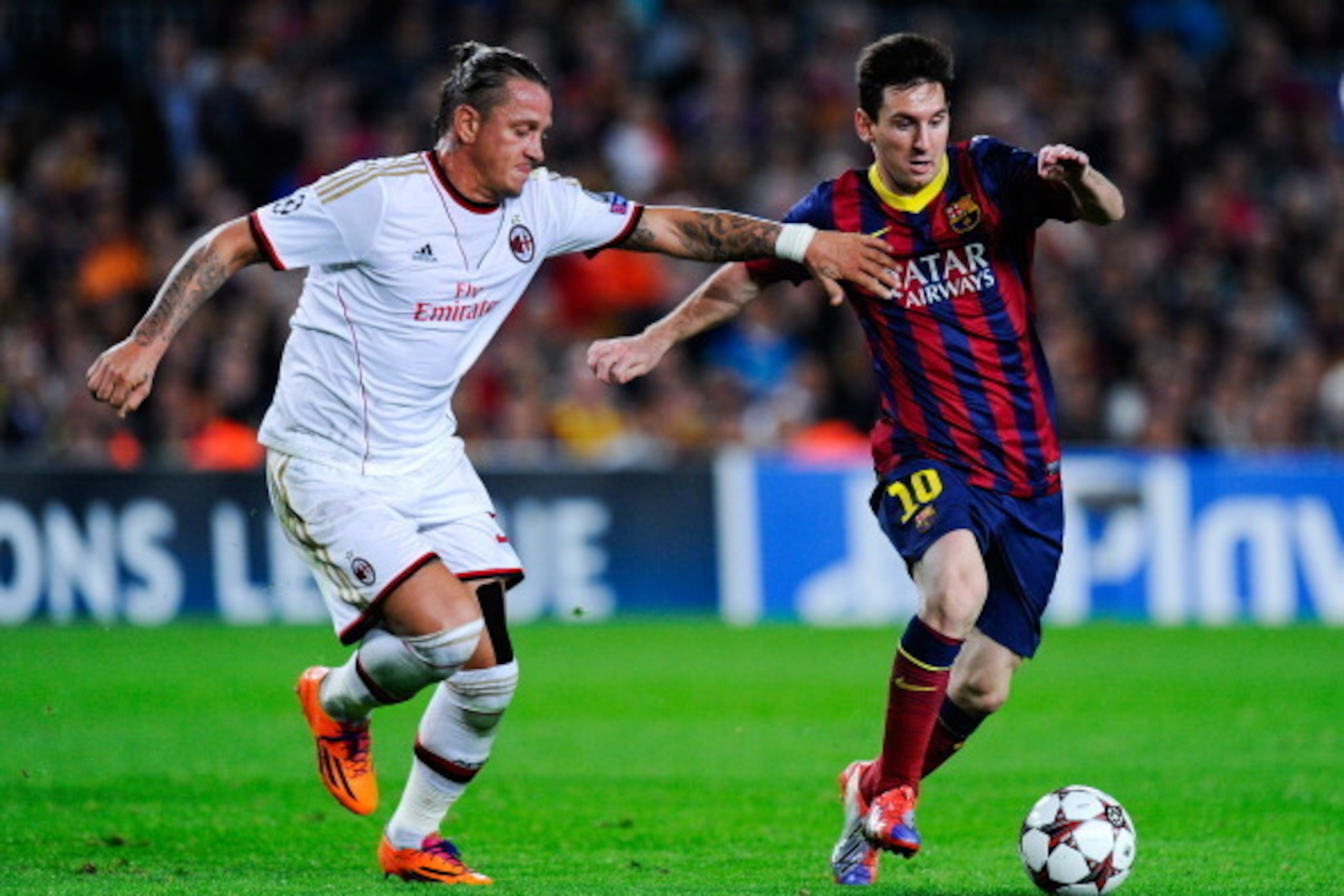 BARCELONA, SPAIN - NOVEMBER 06:  Lionel Messi of FC Barcelona duels for the ball with Philippe Mexes of AC Milan during the UEFA Champions League Group H match Between FC Barcelona and AC Milan at Camp Nou on November 6, 2013 in Barcelona, Spain.  (Photo 