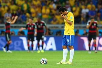 BELO HORIZONTE, BRAZIL - JULY 08:  Fred of Brazil looks dejected as he prepares to kick off after a goal during the 2014 FIFA World Cup Brazil Semi Final match between Brazil and Germany at Estadio Mineirao on July 8, 2014 in Belo Horizonte, Brazil.  (Pho