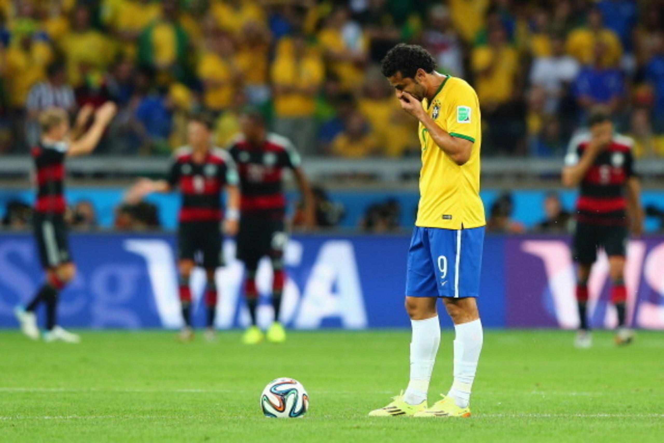 BELO HORIZONTE, BRAZIL - JULY 08:  Fred of Brazil looks dejected as he prepares to kick off after a goal during the 2014 FIFA World Cup Brazil Semi Final match between Brazil and Germany at Estadio Mineirao on July 8, 2014 in Belo Horizonte, Brazil.  (Pho