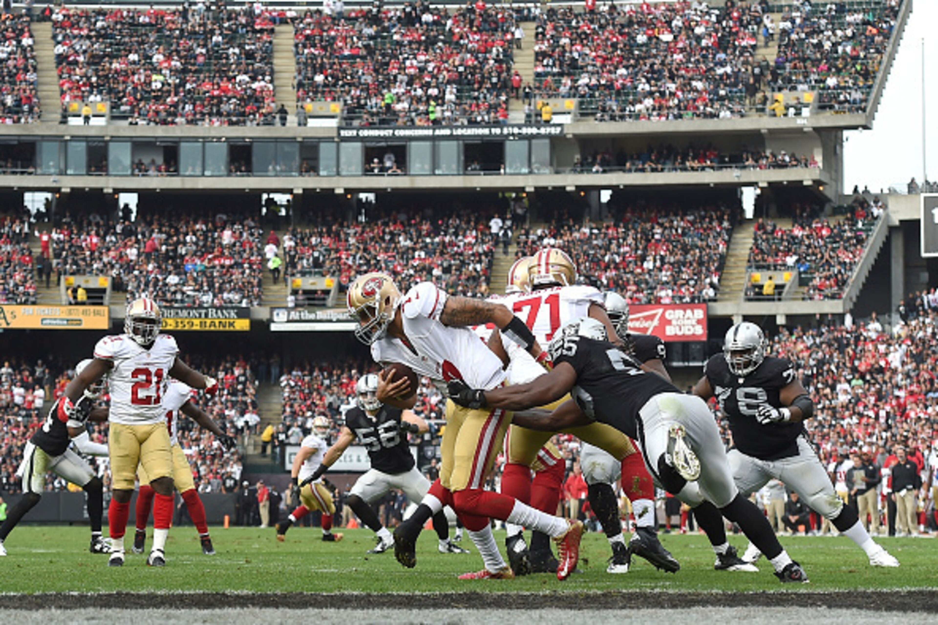 OAKLAND, CA - DECEMBER 07: Sio Moore #55 of the Oakland Raiders gets a hold of Colin Kaepernick #7 of the San Francisco 49ers in the second quarter at O.co Coliseum on December 7, 2014 in Oakland, California. (Photo by Thearon W. Henderson/Getty Images) OAKLAND, CA - DECEMBER 07: Sio Moore #55 of the Oakland Raiders gets a hold of Colin Kaepernick #7 of the San Francisco 49ers in the second quarter at O.co Coliseum on December 7, 2014 in Oakland, California. (Photo by Thearon W. Henderson/Getty Images)