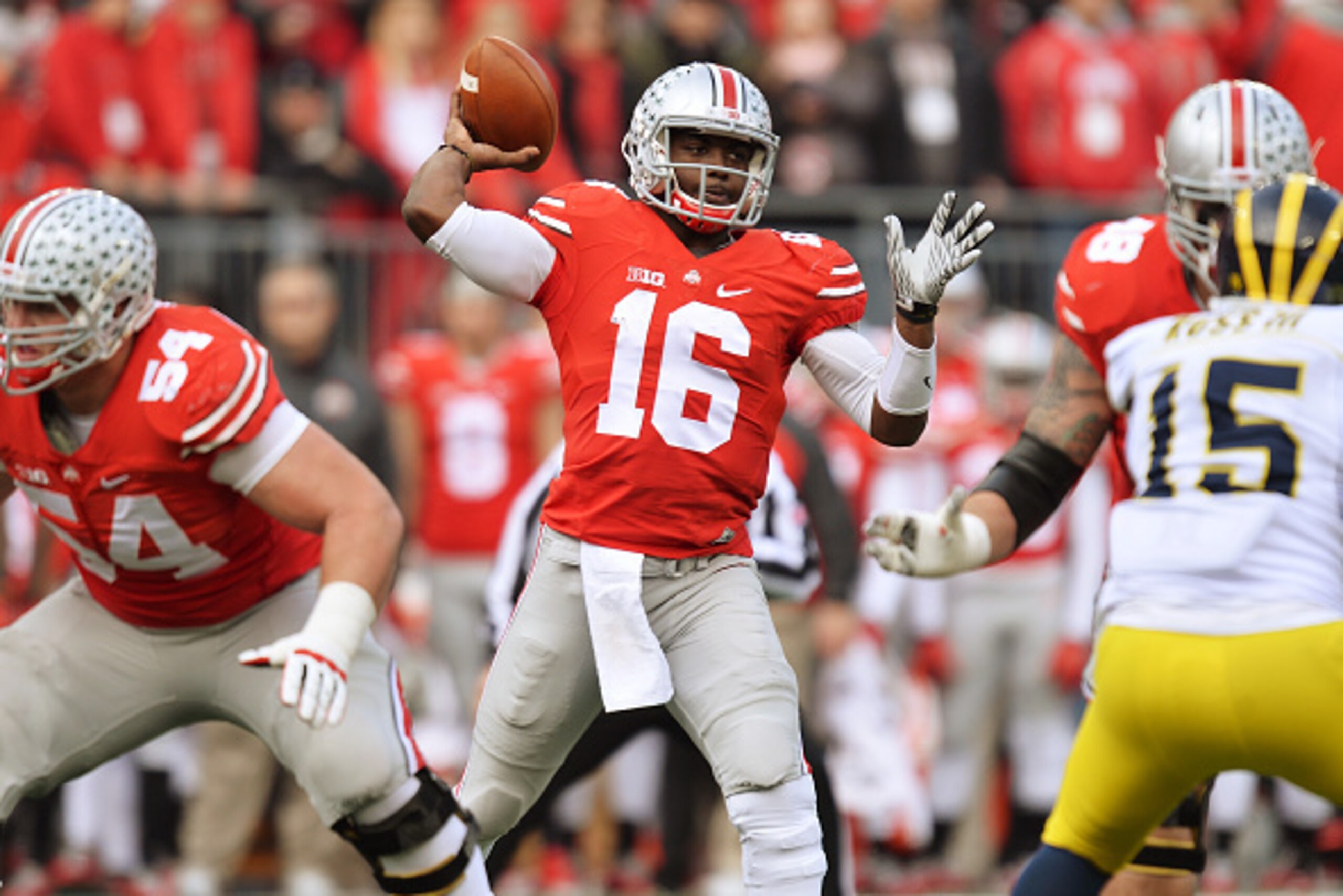 COLUMBUS, OH - NOVEMBER 29:  Quarterback J.T. Barrett #16 of the Ohio State Buckeyes passes against the Michigan Wolverines in the first quarter at Ohio Stadium on November 29, 2014 in Columbus, Ohio.  (Photo by Jamie Sabau/Getty Images)