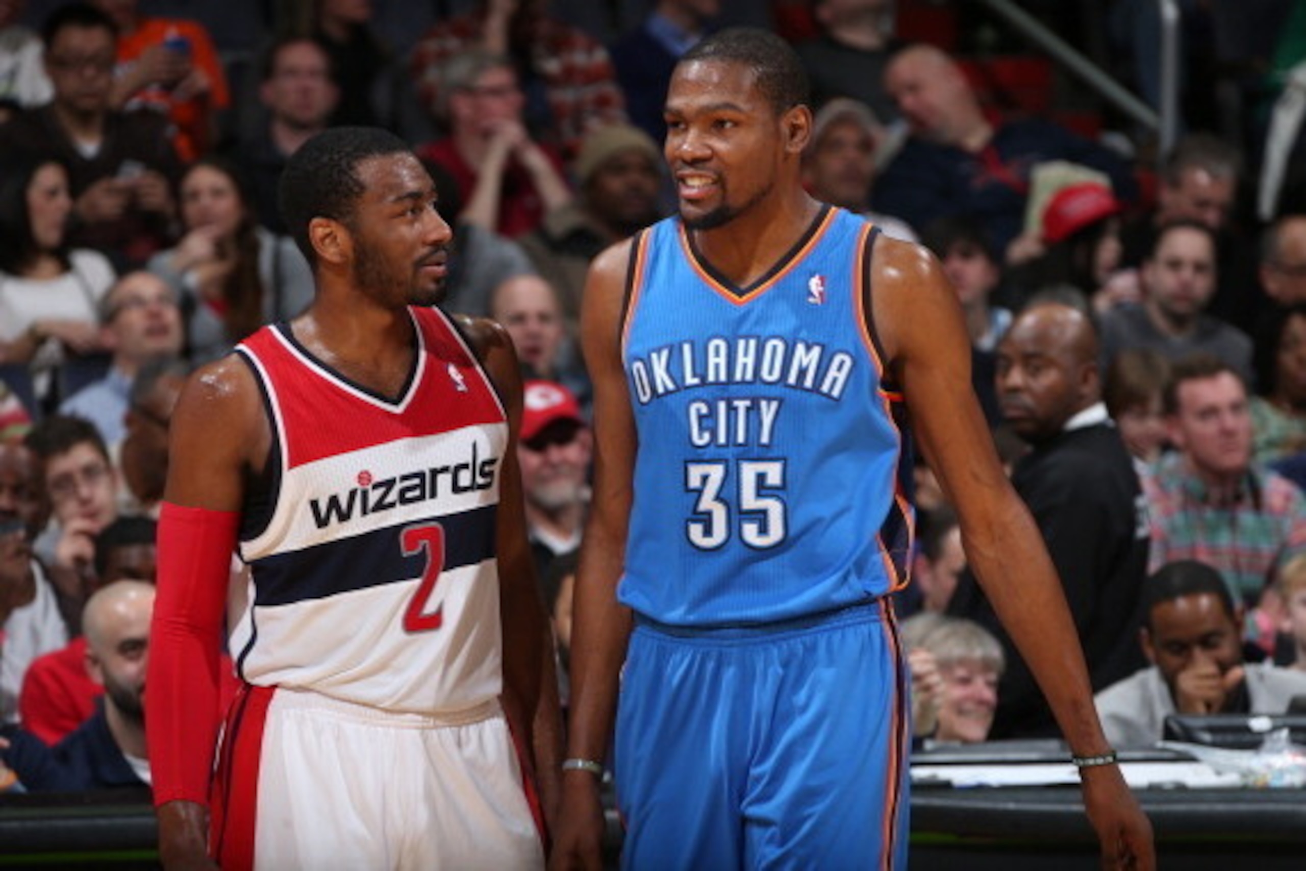WASHINGTON, DC - FEBRUARY 2: John Wall #2 of the Washington Wizards talks with Kevin Durant #35 of the Oklahoma City Thunder during the game at the Verizon Center on February 2, 2014 in Washington, DC. NOTE TO USER: User expressly acknowledges and agrees