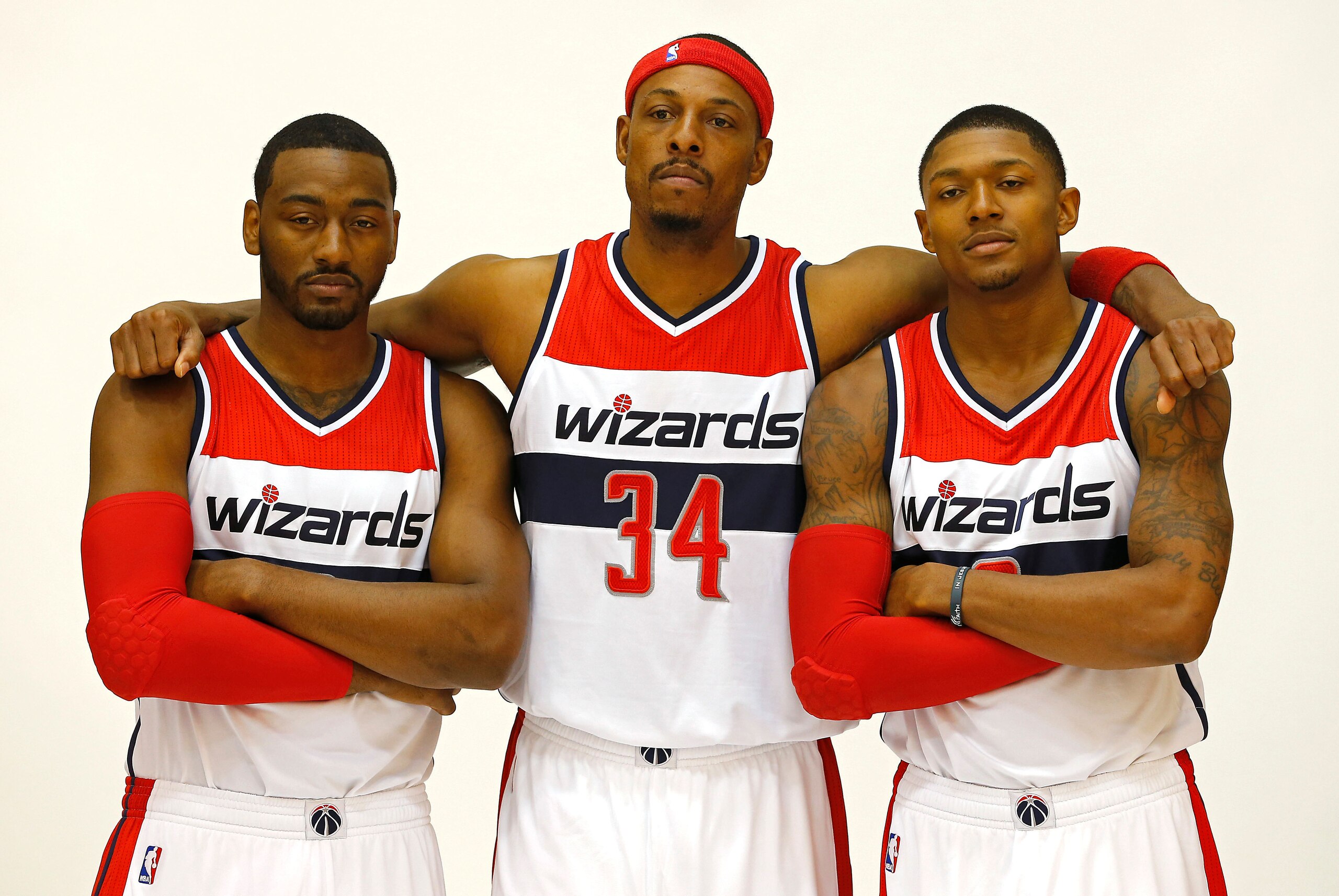 Sep 29, 2014; Washington, DC, USA; Washington Wizards guard John Wall (2), Wizards forward Paul Pierce (34), and Wizards guard Bradley Beal (3) pose for a portrait during Wizards Media Day at Verizon Center. Mandatory Credit: Geoff Burke-USA TODAY Sports
