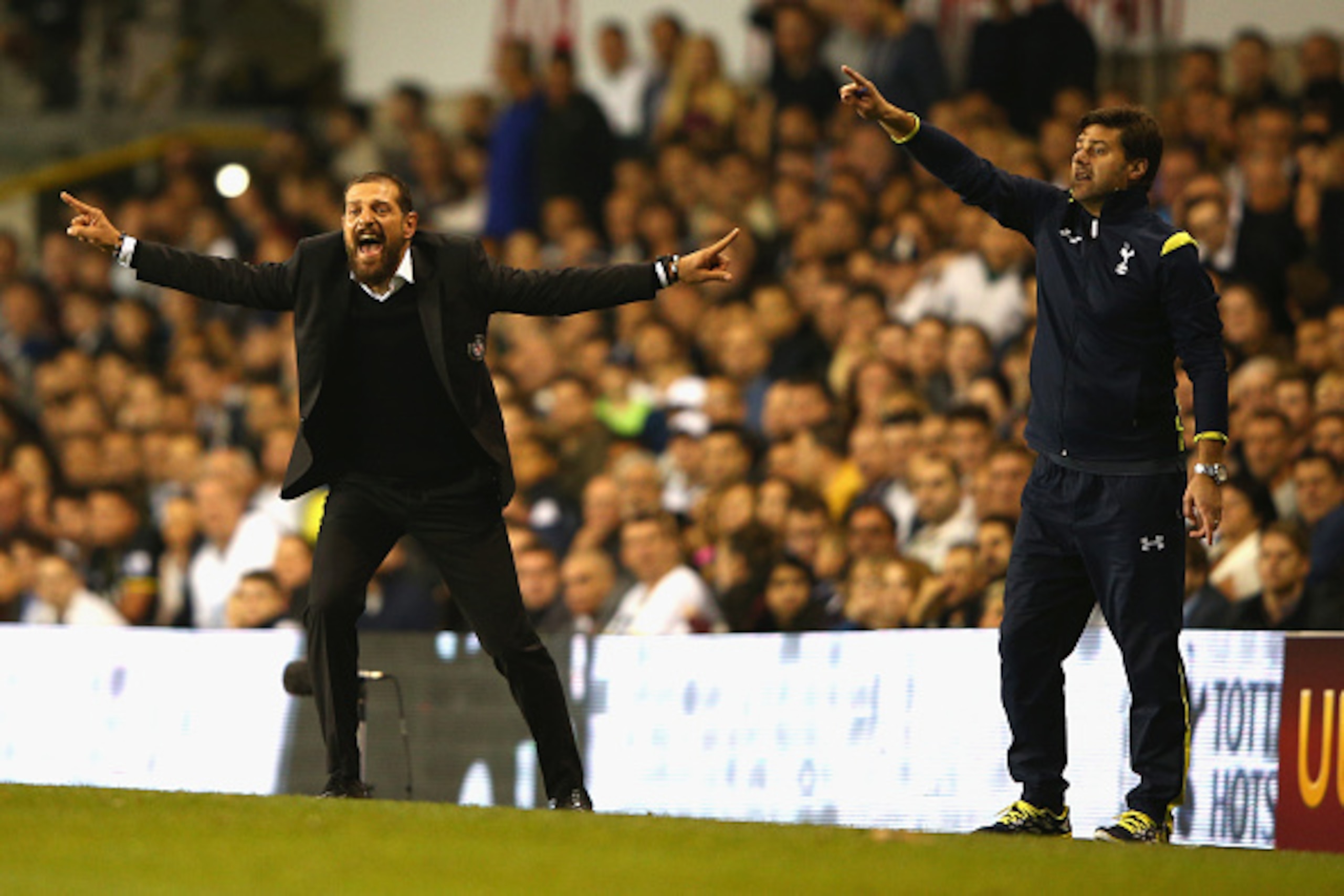 LONDON, ENGLAND - OCTOBER 02:  Head Coach Slaven Bilic of Besiktas and Manager Mauricio Pochettino of Spurs on the touchline during the UEFA Europa League Group C match between Tottenham Hotspur FC and Besiktas JK at White Hart Lane on October 2, 2014 in 