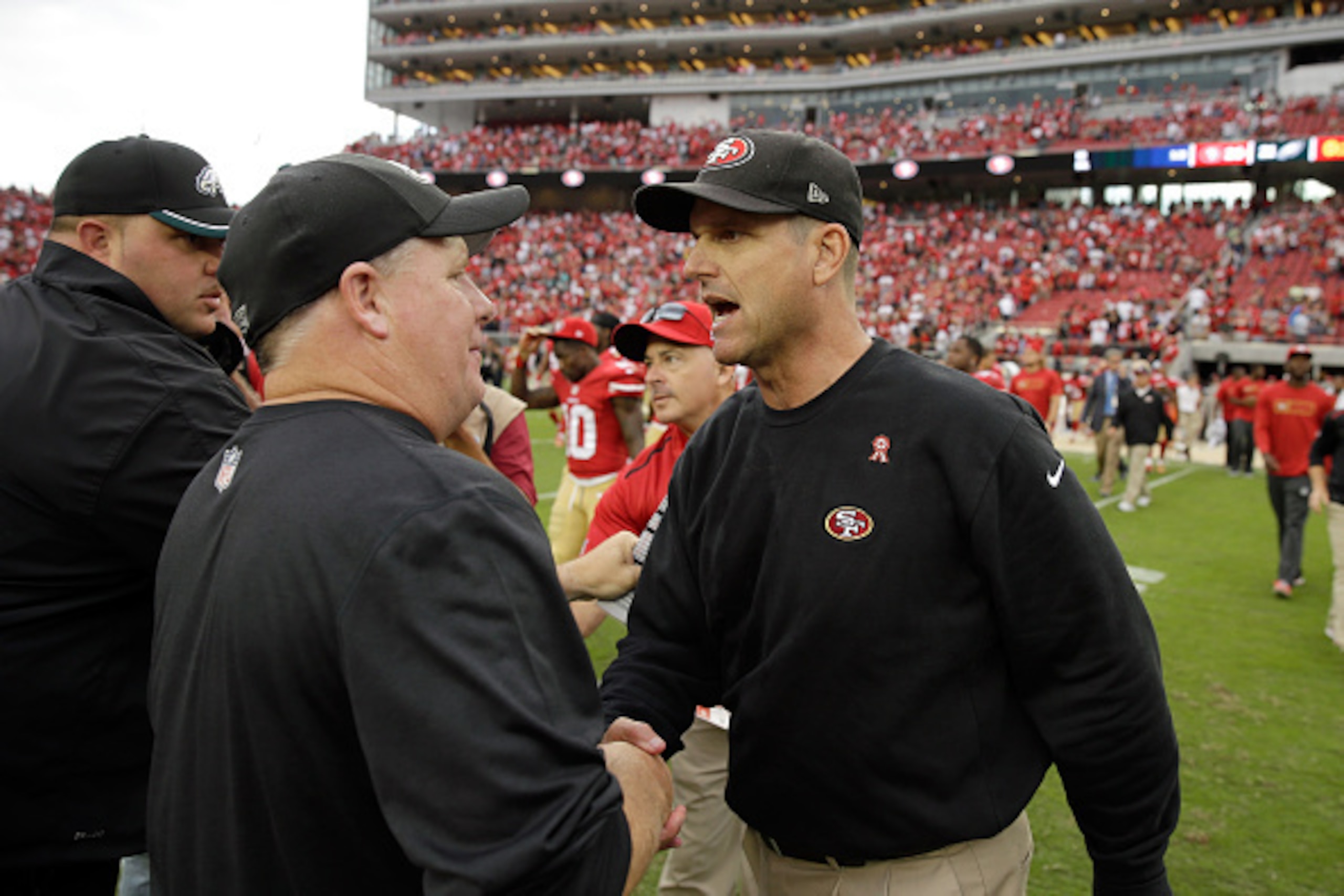 SANTA CLARA, CA - SEPTEMBER 28:  Head coach Jim Harbaugh of the San Francisco 49ers (right) shakes hands with head coach Chip Kelly of the Philadelphia Eagles after the 49ers beat the Eagles at Levi's Stadium on September 28, 2014 in Santa Clara, Californ