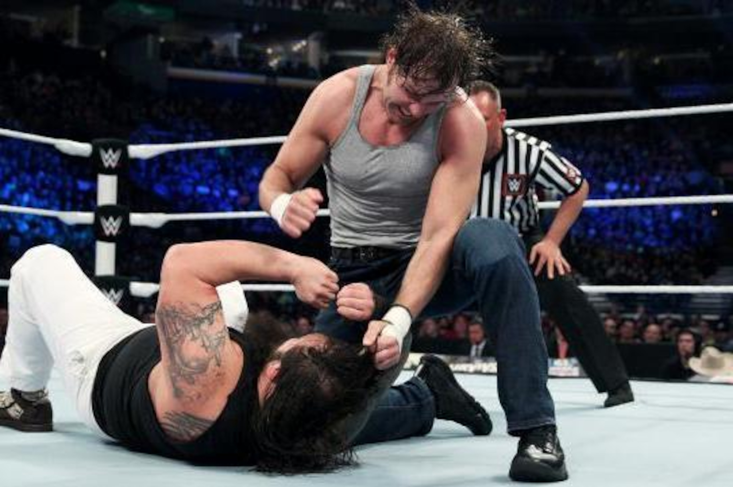Dean Ambrose pounds Bray Wyatt with right hands. Dean Ambrose pounds Bray Wyatt with right hands.