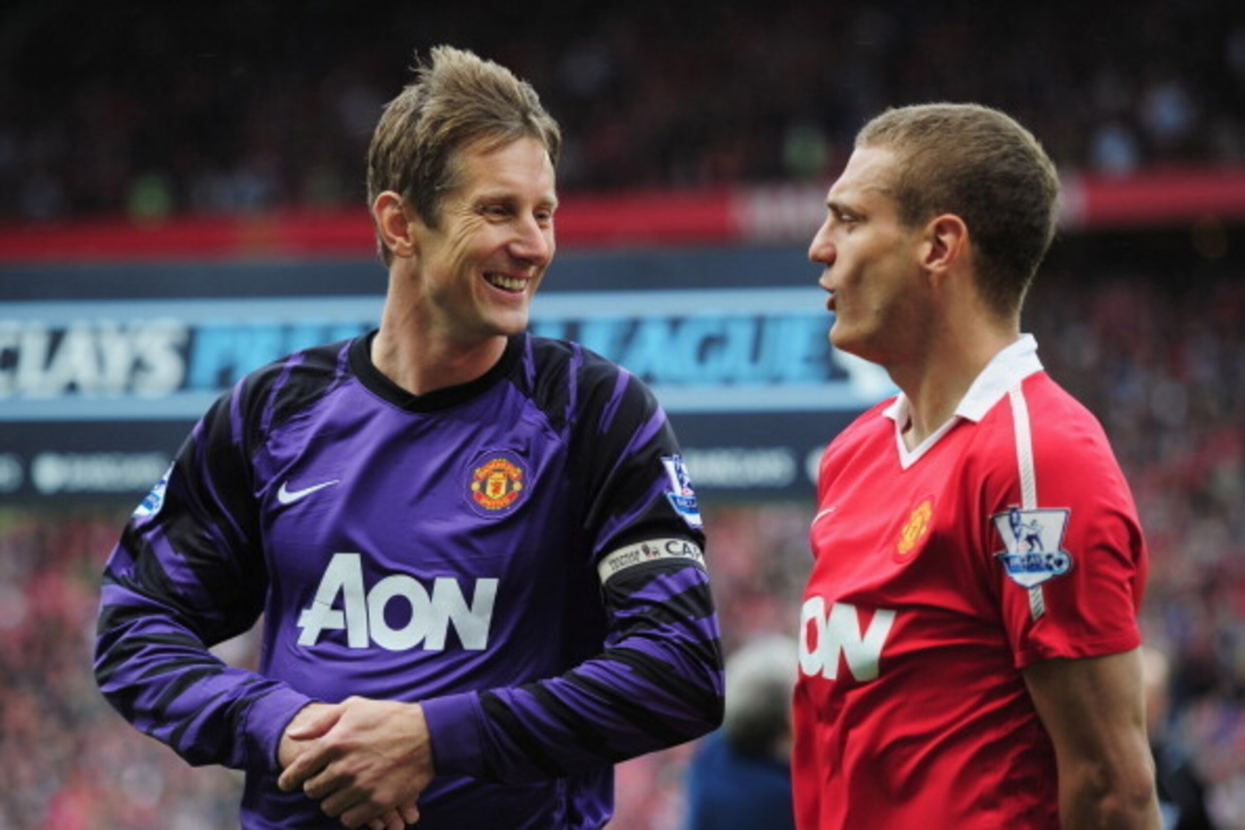 MANCHESTER, ENGLAND - MAY 22:  Edwin van der Sar of Manchester United talks to Nemanja Vidic as he plays his final league match prior to the Barclays Premier League match between Manchester United and Blackpool at Old Trafford on May 22, 2011 in Mancheste