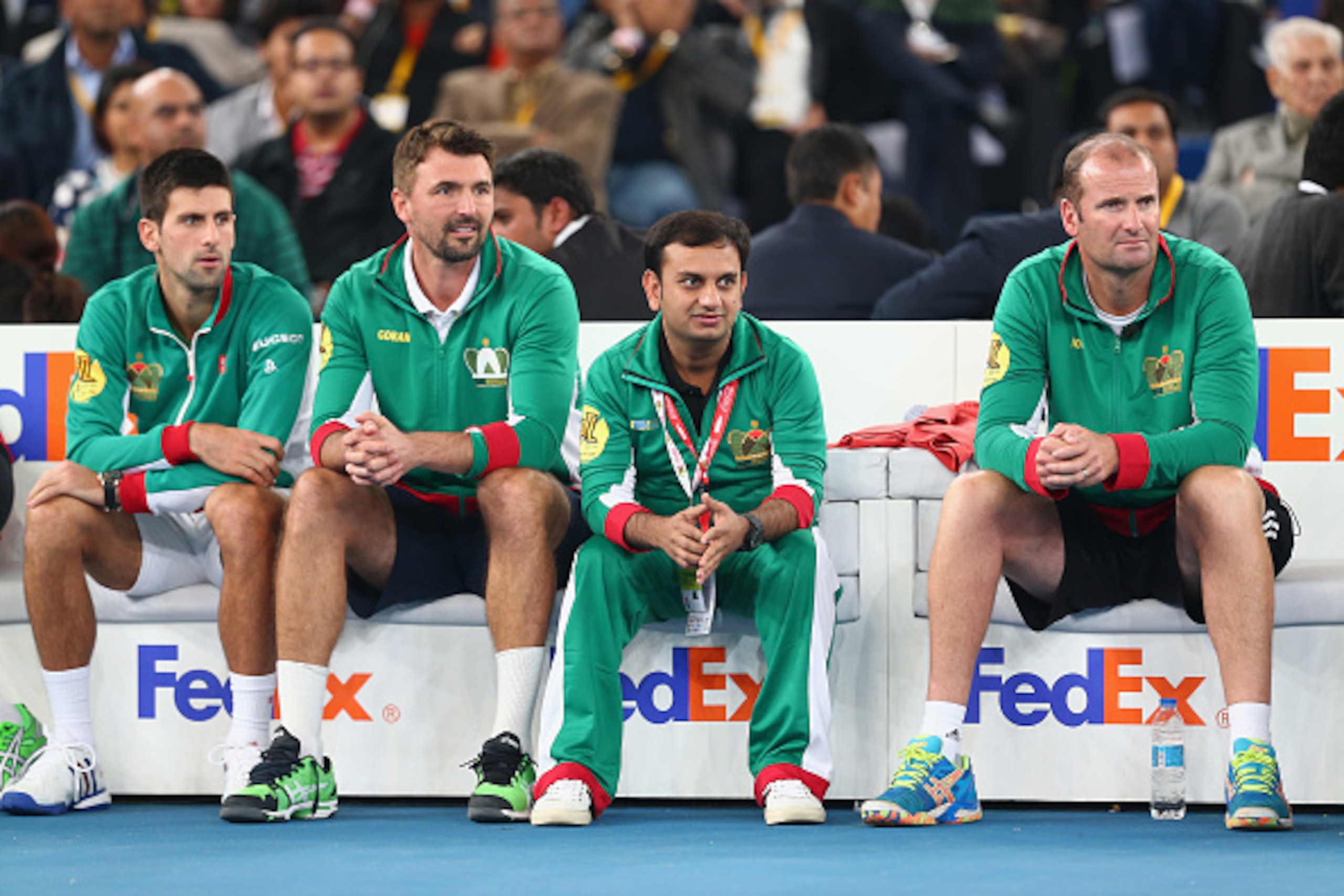 DELHI, INDIA - DECEMBER 08:  Novak Djokovic and Goran Ivanisevic of the UAE Royals sit on the team bench as they play the Indian Aces during the Coca-Cola International Premier Tennis League third leg at the Indira Gandhi Indoor Stadium December 8, 2014 i