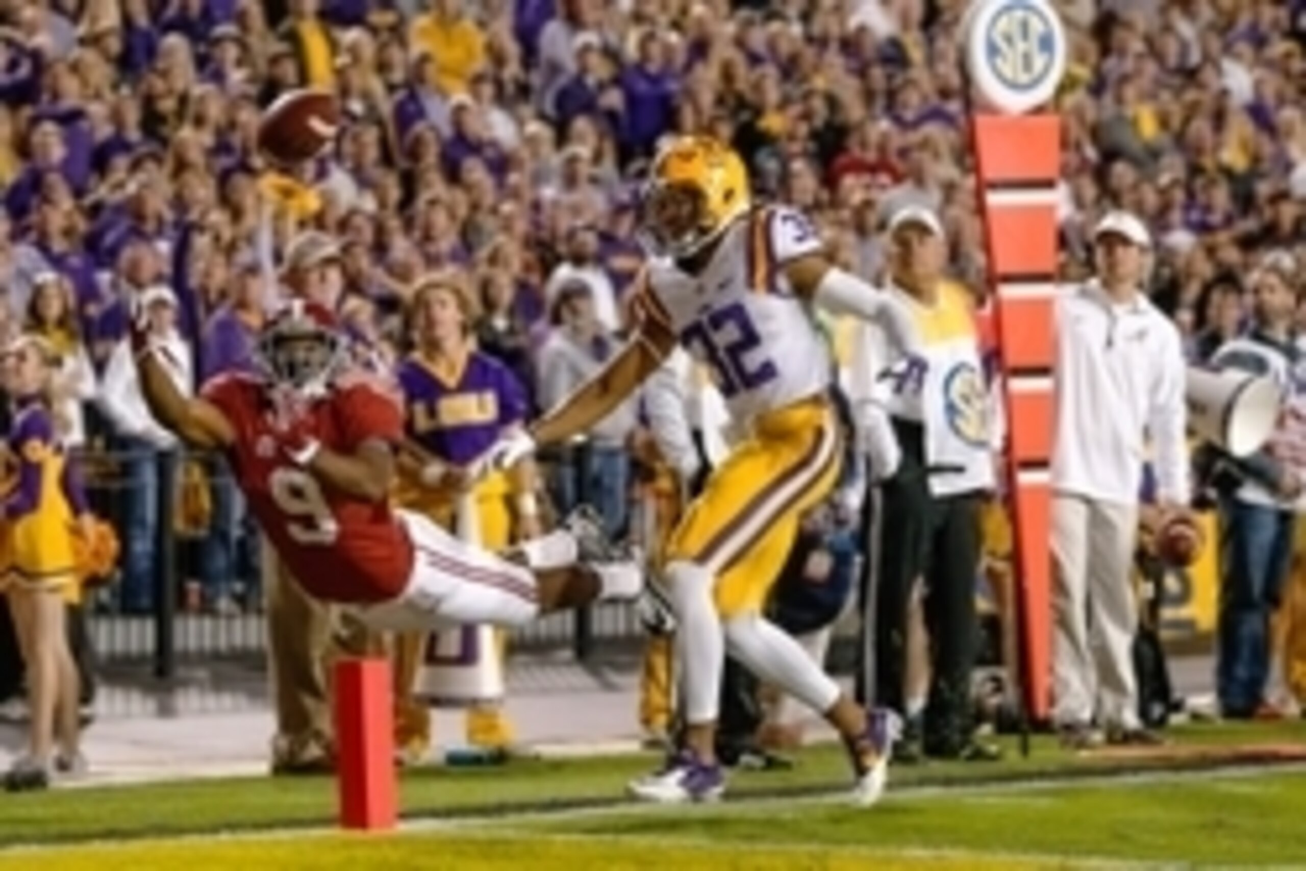 Nov 8, 2014; Baton Rouge, LA, USA; Alabama Crimson Tide wide receiver Amari Cooper (9) stretches out but is unable to hold onto the ball as LSU Tigers cornerback Jalen Collins (32) defends during the second quarter of a game at Tiger Stadium. Mandatory Cr