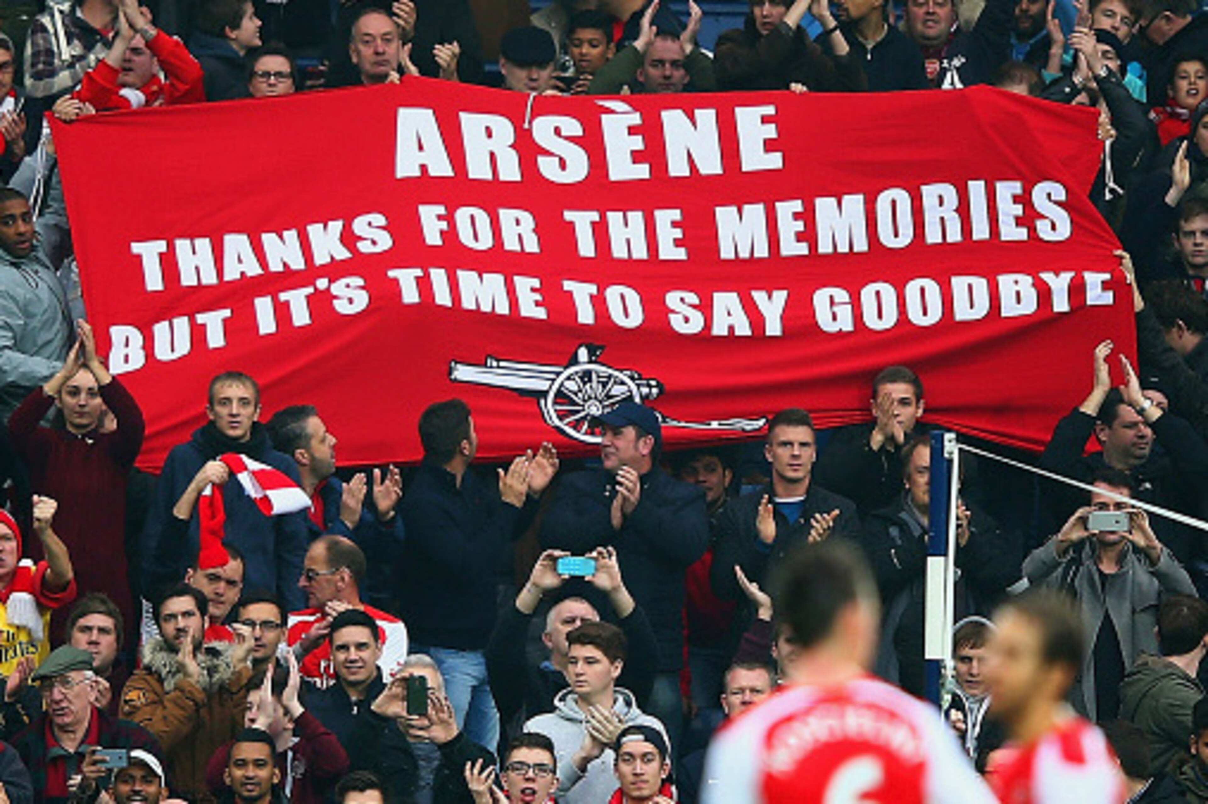 WEST BROMWICH, ENGLAND - NOVEMBER 29:   (EDITORS NOTE: This is a retransmission of image #459708260 with an alternative crop)   Arsenal fans hold up a banner for Arsene Wenger, manager of Arsenal during the Barclays Premier League match between West Bromw