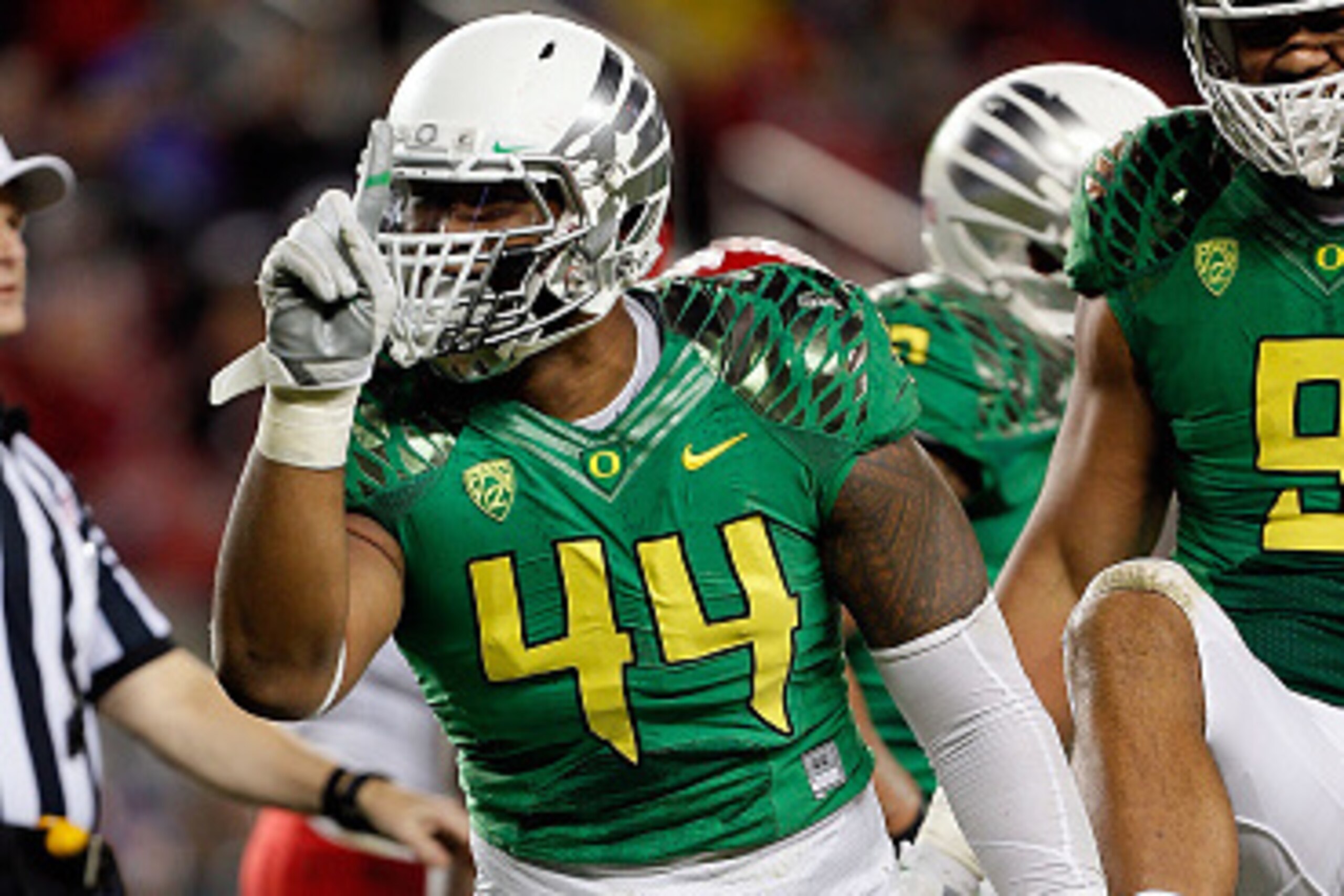 SANTA CLARA, CA - DECEMBER 05: DeForest Buckner #44 of the Oregon Ducks celebrates in front of fans during the first half of the PAC-12 Championships against the Arizona Wildcats at Levi's Stadium on December 5, 2014 in Santa Clara, California. (Photo by 