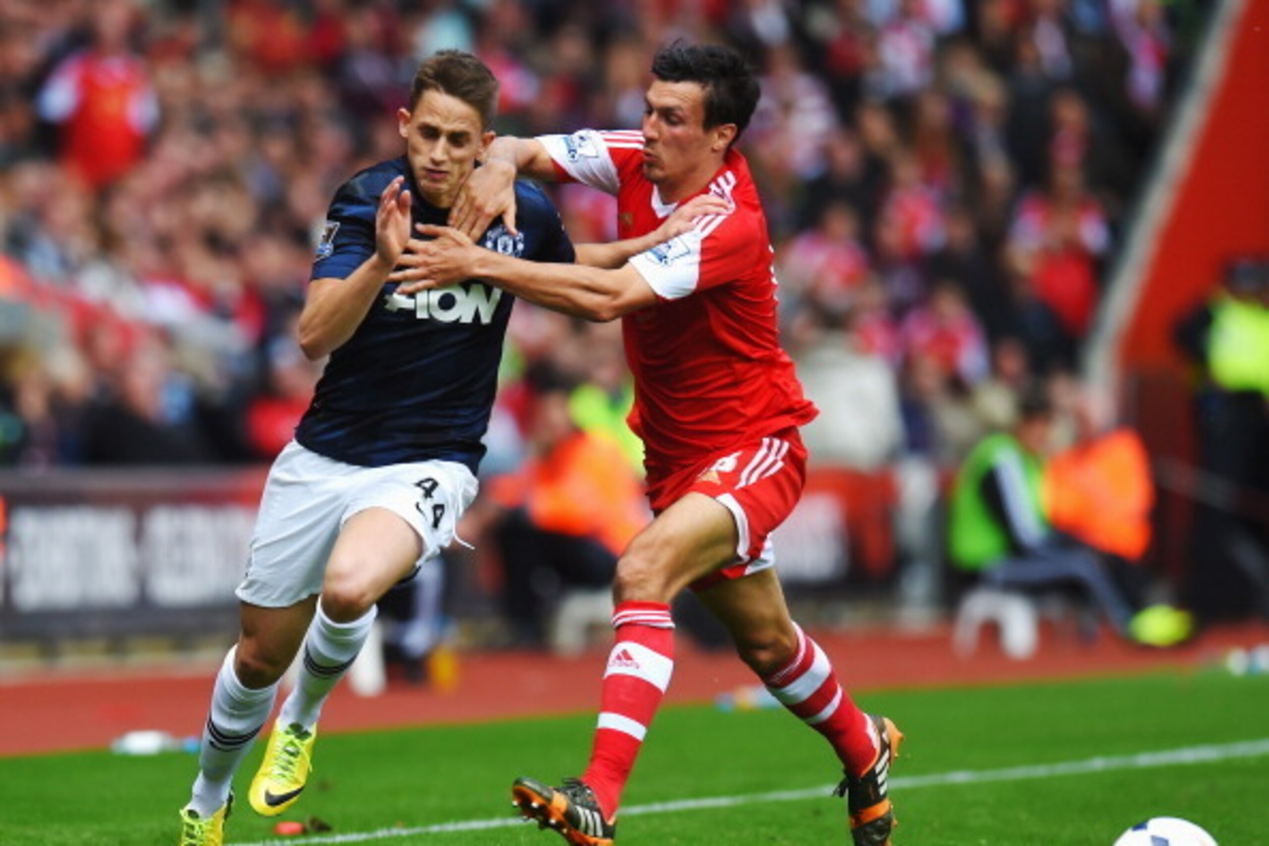 SOUTHAMPTON, ENGLAND - MAY 11:  (L-R) Adnan Januzaj of Manchester United is challenged by Jack Cork of Southampton during the Barclays Premier League match between Southampton and Manchester United at St Mary's Stadium on May 11, 2014 in Southampton, Engl