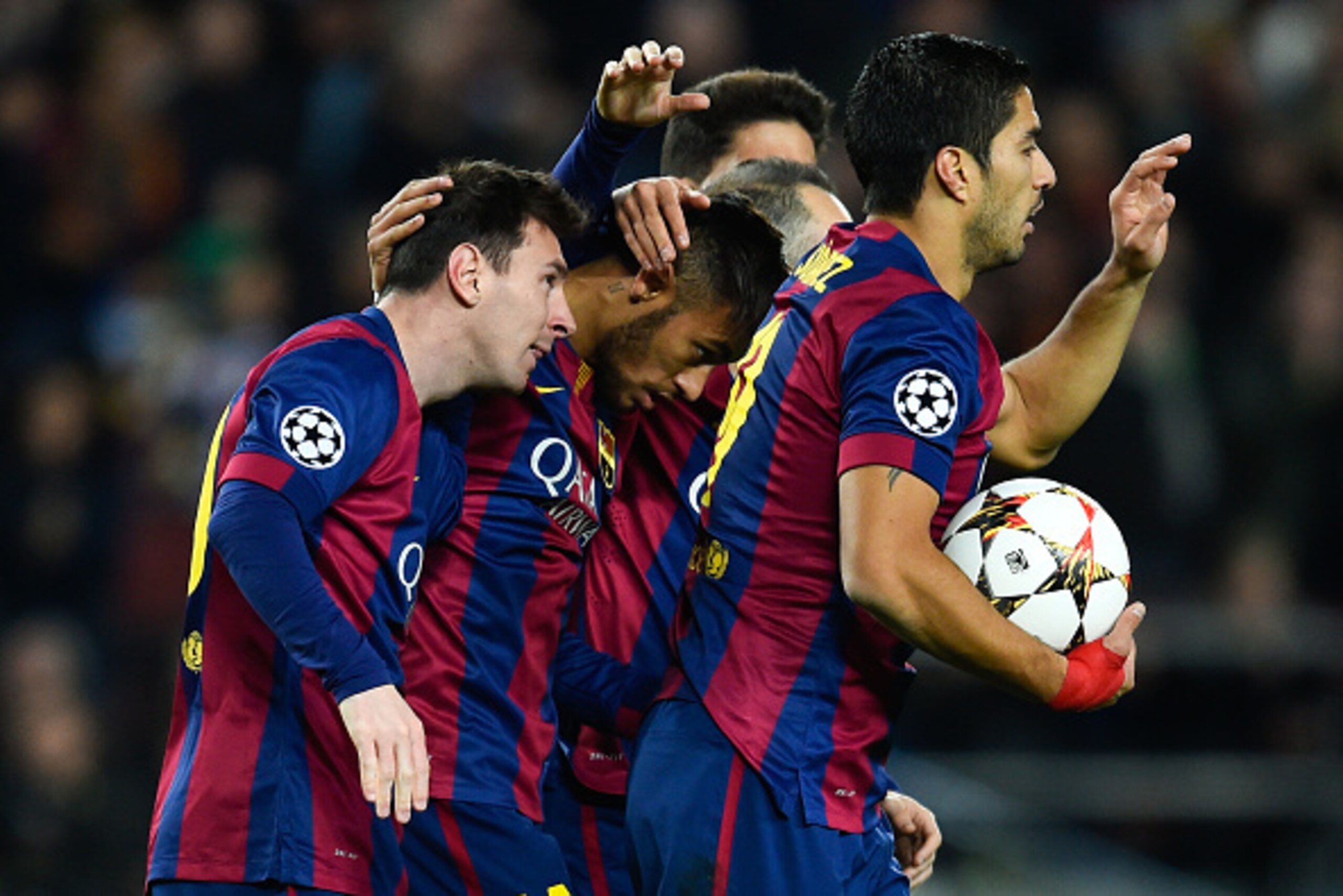 BARCELONA, SPAIN - DECEMBER 10:  Lionel Messi (L) of FC Barcelona celebrates after scoringm their first goal during the UEFA Champions League group F match between FC Barcelona and Paris Saint-Germanin FC at Camp Nou Stadium on December 10, 2014 in Barcel