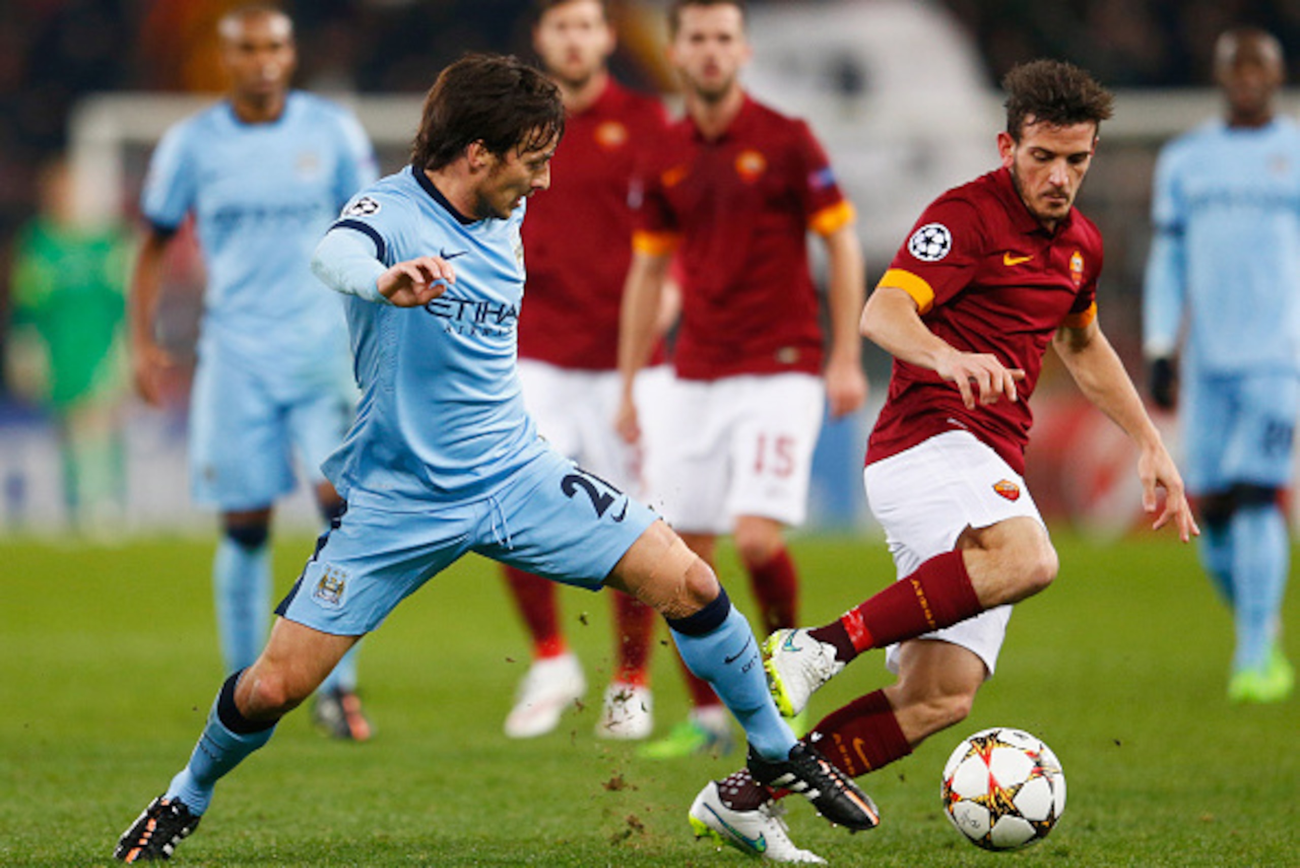 ROME, ITALY - DECEMBER 10: Mattia Destro of AS Roma battles with David Silva of Manchester City during the UEFA Champions League Group E match between AS Roma and Manchester City FC at Stadio Olimpico on December 10, 2014 in Rome, Italy. (Photo by Julia ROME, ITALY - DECEMBER 10: Mattia Destro of AS Roma battles with David Silva of Manchester City during the UEFA Champions League Group E match between AS Roma and Manchester City FC at Stadio Olimpico on December 10, 2014 in Rome, Italy. (Photo by Julia