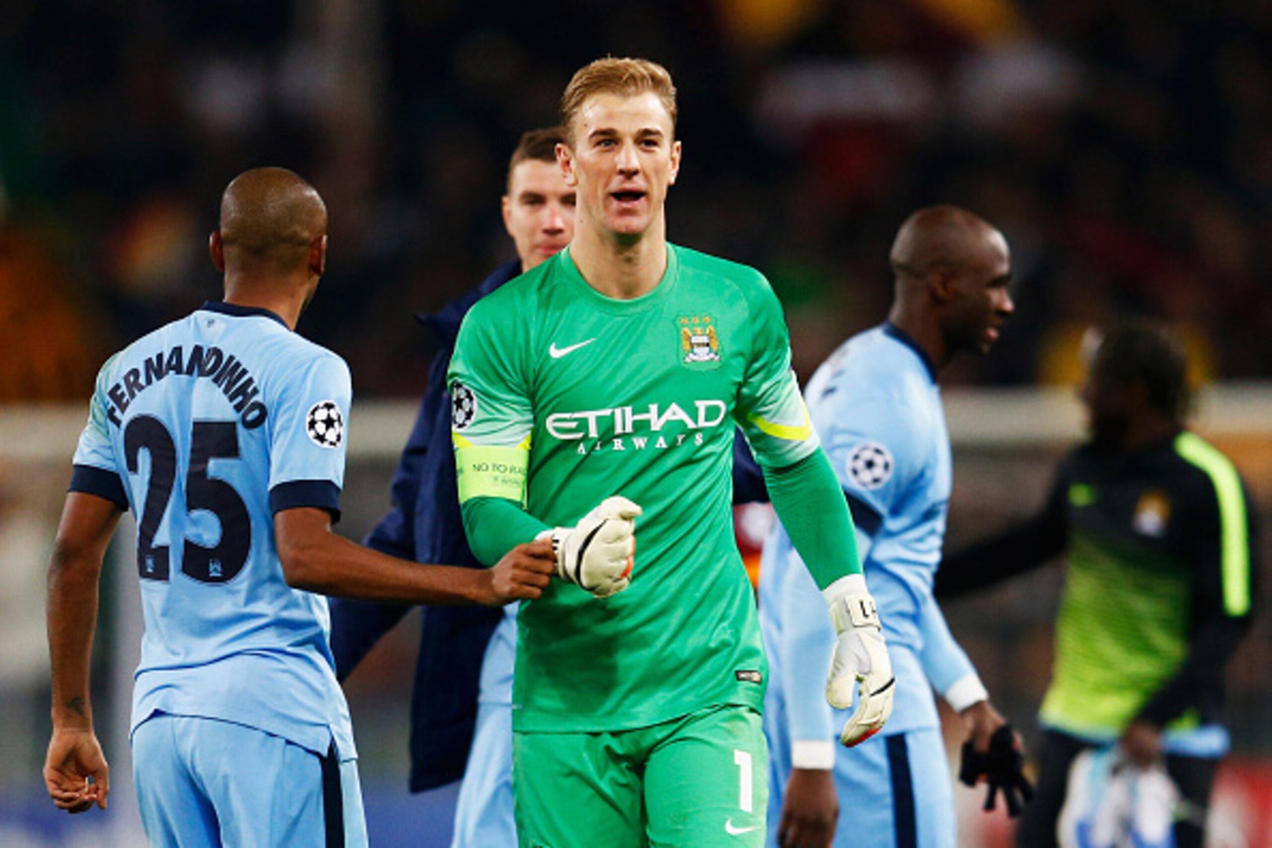 ROME, ITALY - DECEMBER 10:  Joe Hart and Fernandinho of Manchester City celebrate victory and qualification after the UEFA Champions League Group E match between AS Roma and Manchester City FC at Stadio Olimpico on December 10, 2014 in Rome, Italy.  (Phot