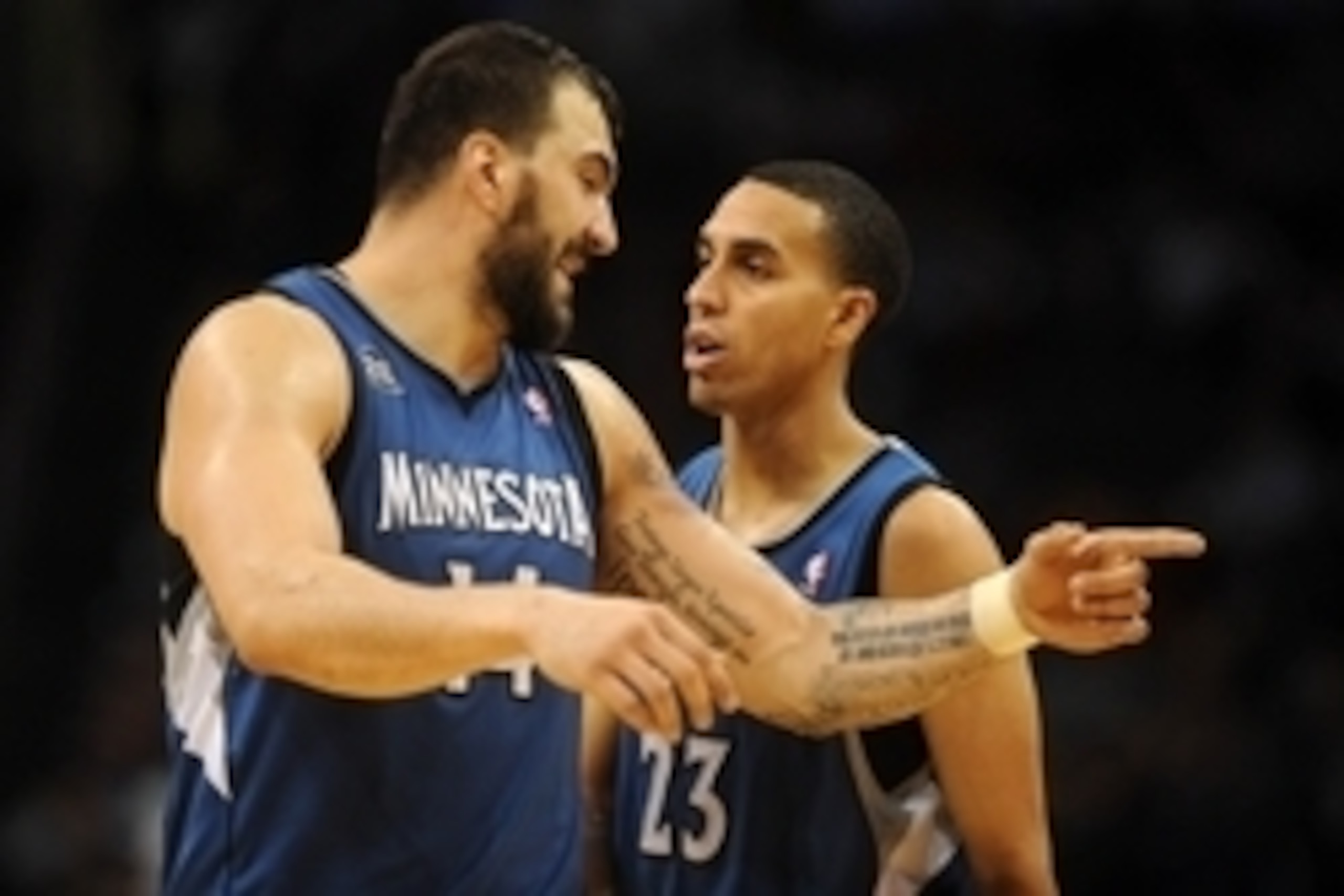 Dec 1, 2013; Oklahoma City, OK, USA; Minnesota Timberwolves center Nikola Pekovic (14) talks to Minnesota Timberwolves shooting guard Kevin Martin (23) in a break in action against the Oklahoma City Thunder at Chesapeake Energy Arena. Mandatory Credit: Ma
