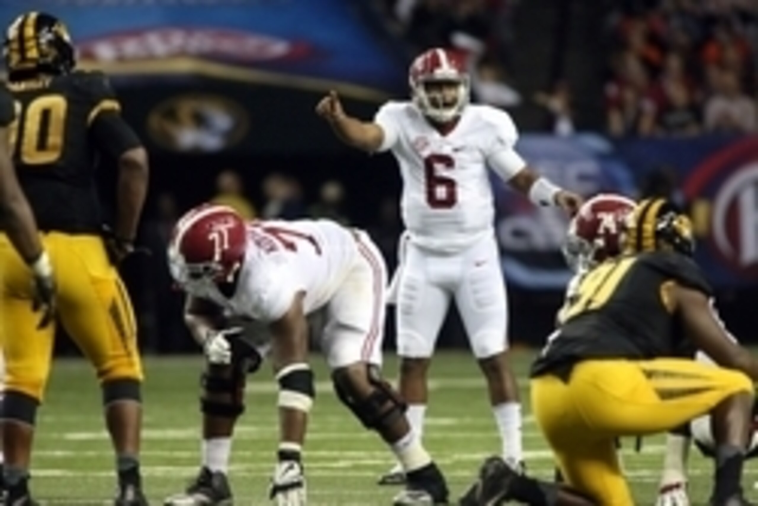 Dec 6, 2014; Atlanta, GA, USA;  Alabama Crimson Tide quarterback Blake Sims (6) is shown behind offensive lineman Arie Kouandjio (77) before a play in their game against the Missouri Tigers in the 2014 SEC Championship at the Georgia Dome. Alabama beat Mi