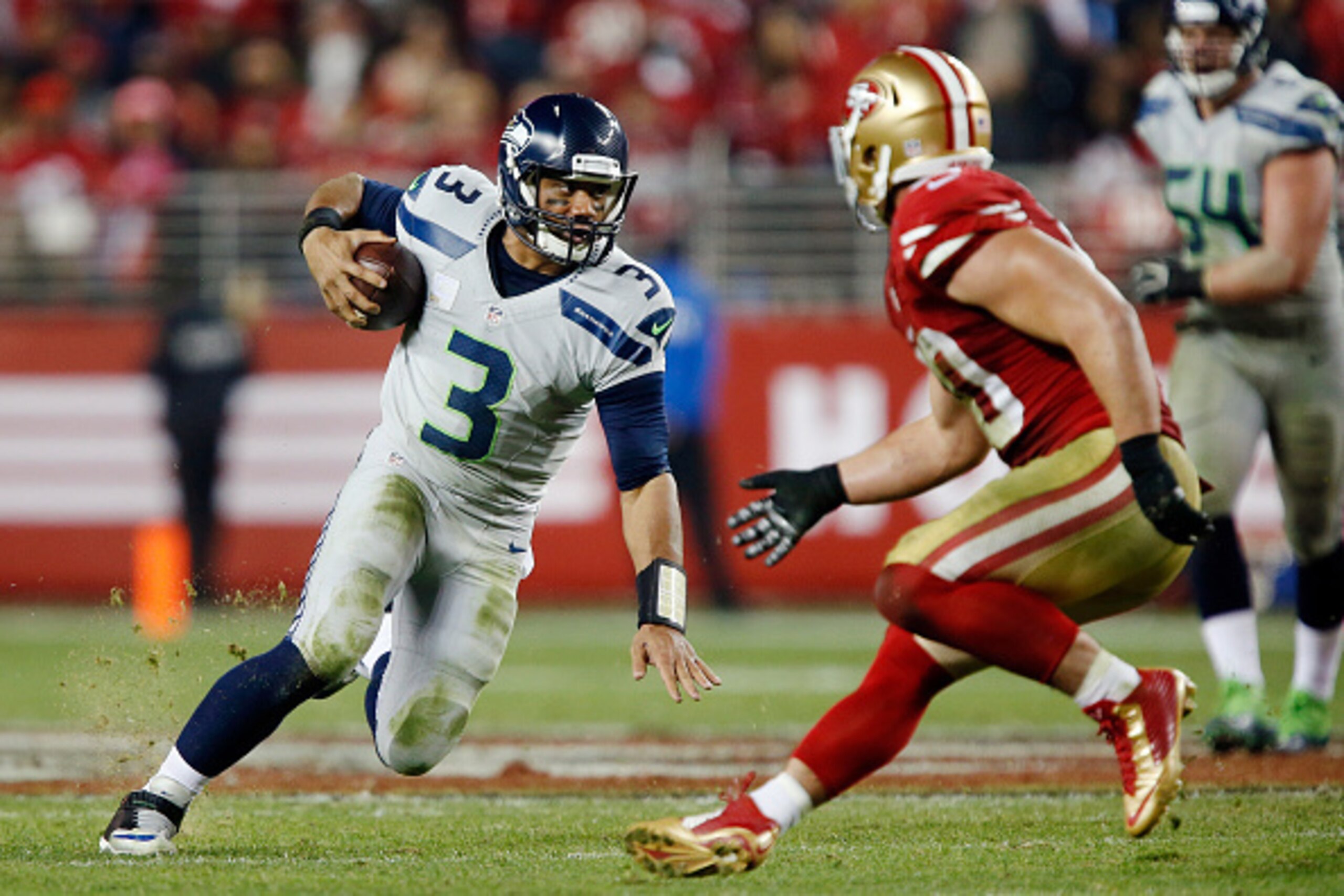 SANTA CLARA, CA - NOVEMBER 27:  Quarterback Russell Wilson #3 of the Seattle Seahawks takes off running for a 12-yard gain against the San Francisco 49ers in the fourth quarter on November 27, 2014 at Levi's Stadium in Santa Clara, California.  The Seahaw