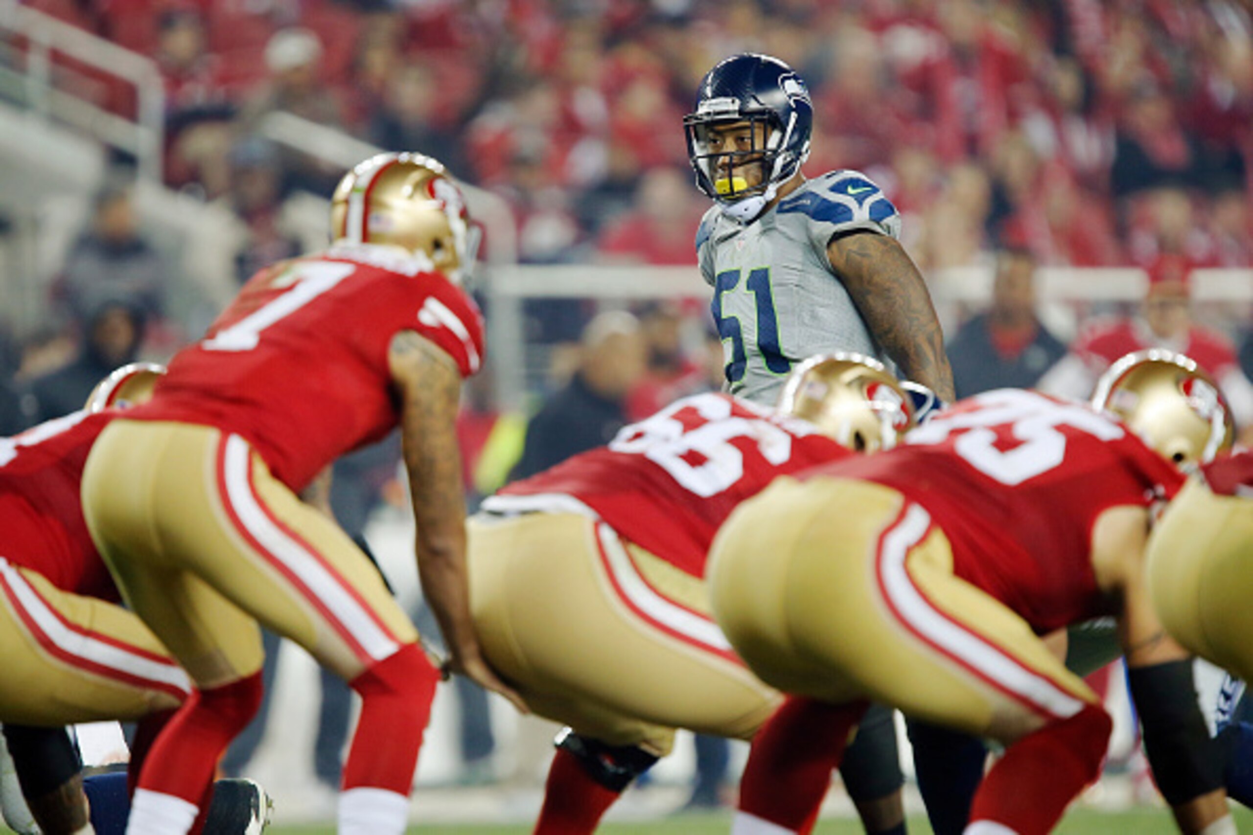 SANTA CLARA, CA - NOVEMBER 27:  Linebacker Bruce Irvin #51 of the Seattle Seahawks eyes quarterback Colin Kaepernick #7 of the San Francisco 49ers in the third quarter on November 27, 2014 at Levi's Stadium in Santa Clara, California.  The Seahawks won 19