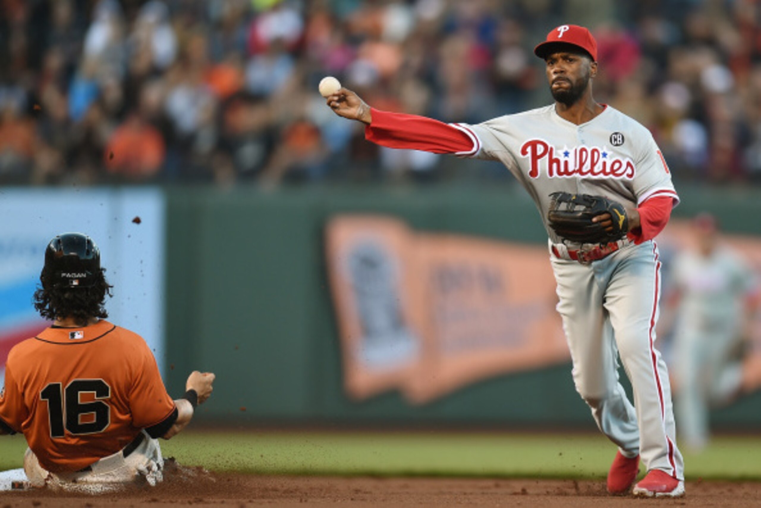 SAN FRANCISCO, CA - AUGUST 15:  Jimmy Rollins #11 of the Philadelphia Phillies completes the double play over the top of Angel Pagan #16 of the San Francisco Giants in the bottom of the first inning at AT&T Park on August 15, 2014 in San Francisco, Califo