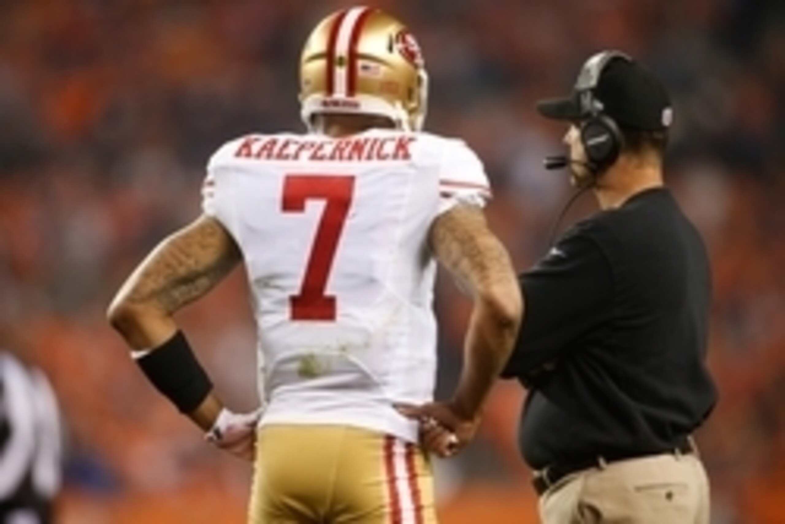 Oct 19, 2014; Denver, CO, USA; San Francisco 49ers quarterback Colin Kaepernick (7) and head coach Jim Harbaugh during the game against the Denver Broncos at Sports Authority Field at Mile High. Mandatory Credit: Chris Humphreys-USA TODAY Sports