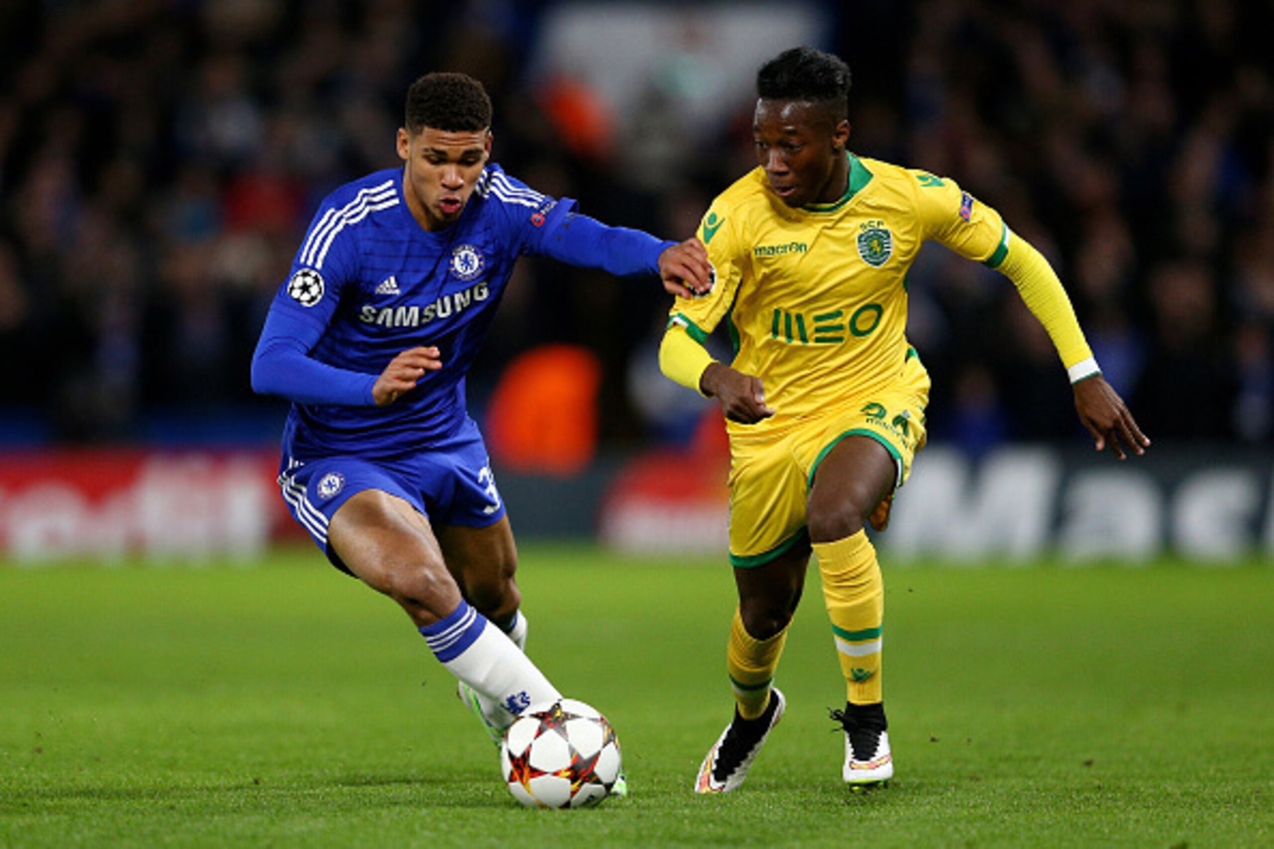 LONDON, ENGLAND - DECEMBER 10:  Carlos Mane of Sporting Lisbon is challenged by Ruben Loftus-Cheek of Chelsea during the UEFA Champions League group G match between Chelsea and Sporting Clube de Portugal at Stamford Bridge on December 10, 2014 in London, 