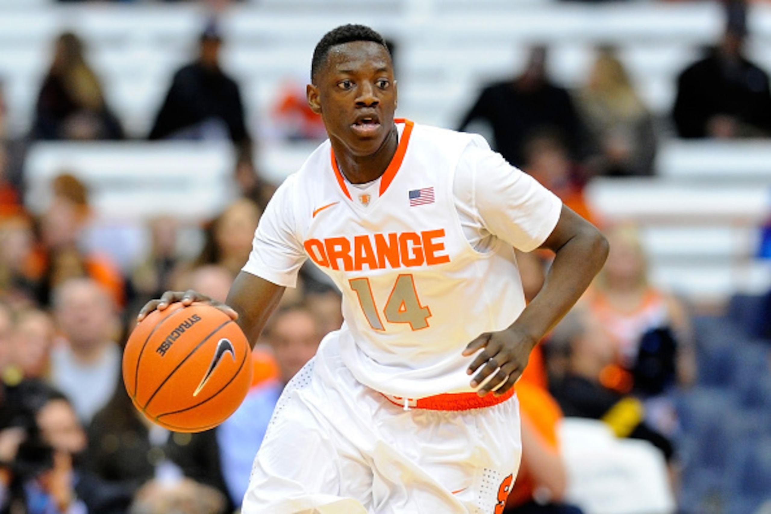 SYRACUSE, NY - NOVEMBER 28:  Kaleb Joseph #14 of the Syracuse Orange dribbles the ball up the court Holy Cross Crusaders during the first half at the Carrier Dome on November 28, 2014 in Syracuse, New York.  Syracuse defeated Holy Cross 72-48.  (Photo by 